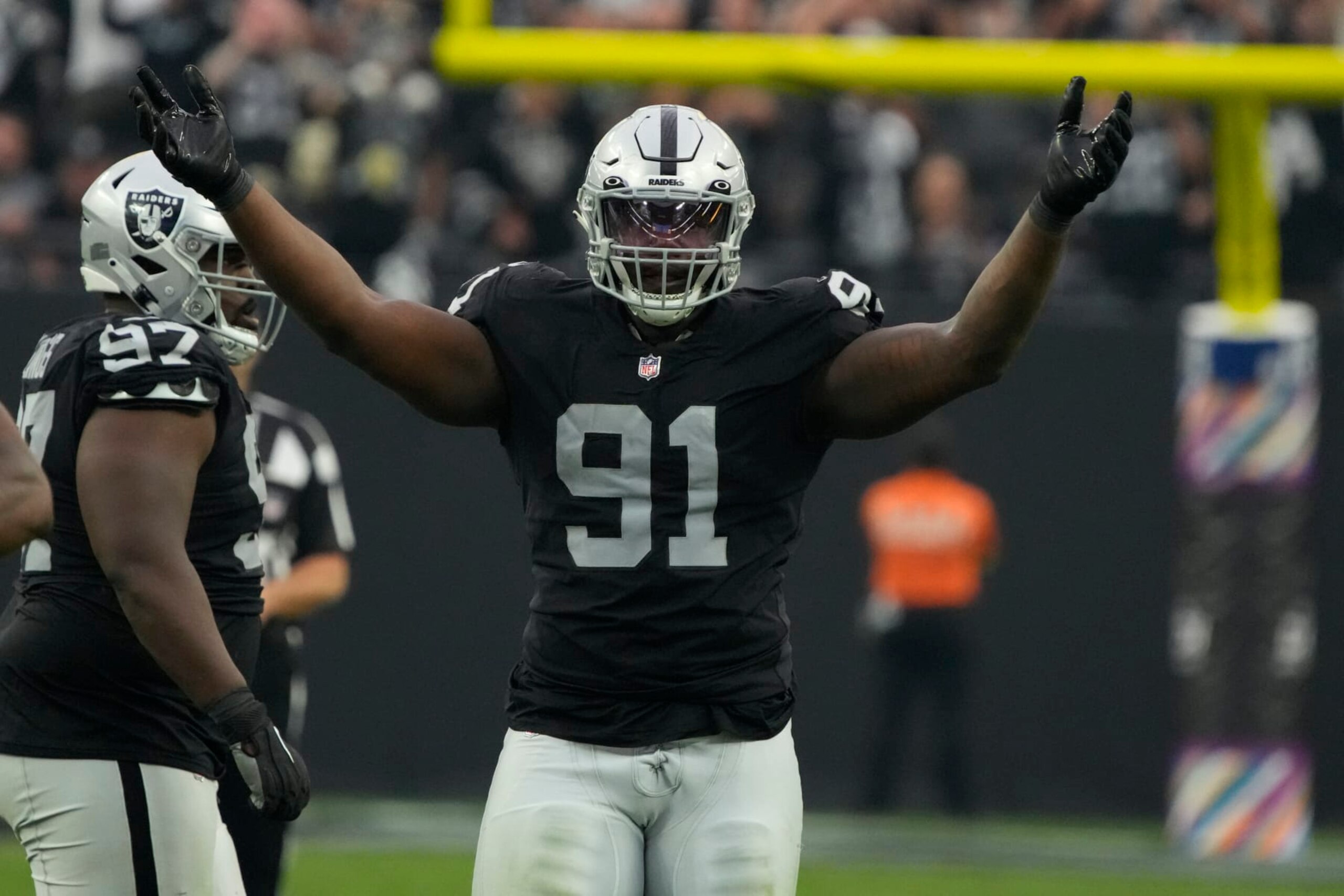 Las Vegas Raiders defensive tackle Bilal Nichols (91) yells to the fans during an NFL football game against the Houston Texans, Sunday, Oct 23, 2022, in Las Vegas. (AP Photo/Rick Scuteri) Las Vegas Raiders defensive tackle Bilal Nichols (91) yells to the fans during an NFL football game against the Houston Texans, Sunday, Oct 23, 2022, in Las Vegas. (AP Photo/Rick Scuteri)