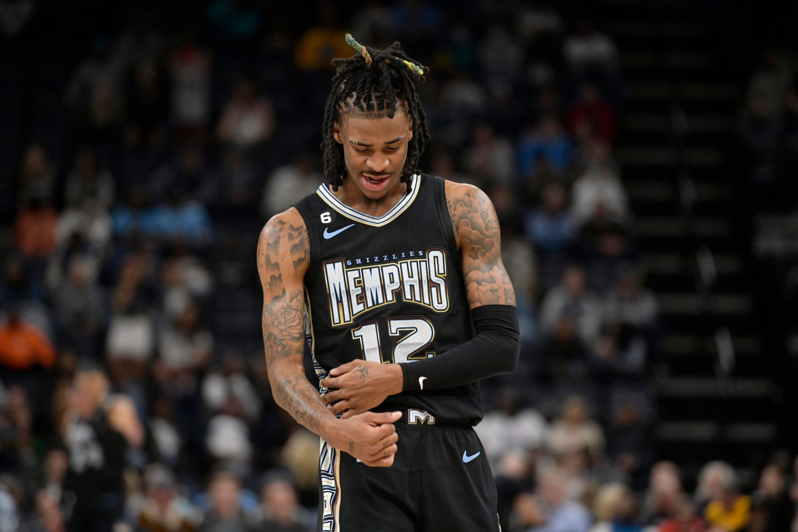Memphis Grizzlies guard Ja Morant (12) reacts in the second half of an NBA basketball game against the Minnesota Timberwolves Friday, Nov. 11, 2022, in Memphis, Tenn. (AP Photo/Brandon Dill)