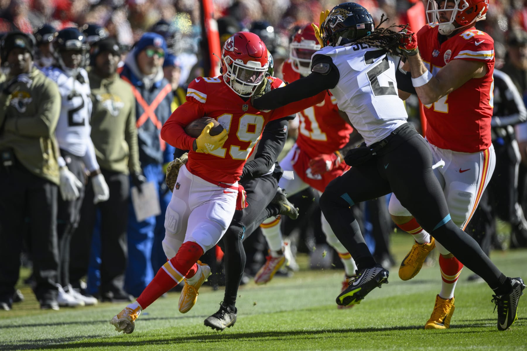 Jacksonville Jaguars safety Rayshawn Jenkins (2) tackles Kansas City Chiefs wide receiver Kadarius Toney (19) during the first half of an NFL football game, Sunday, Nov. 13, 2022 in Kansas City, Mo. (AP Photo/Reed Hoffmann)