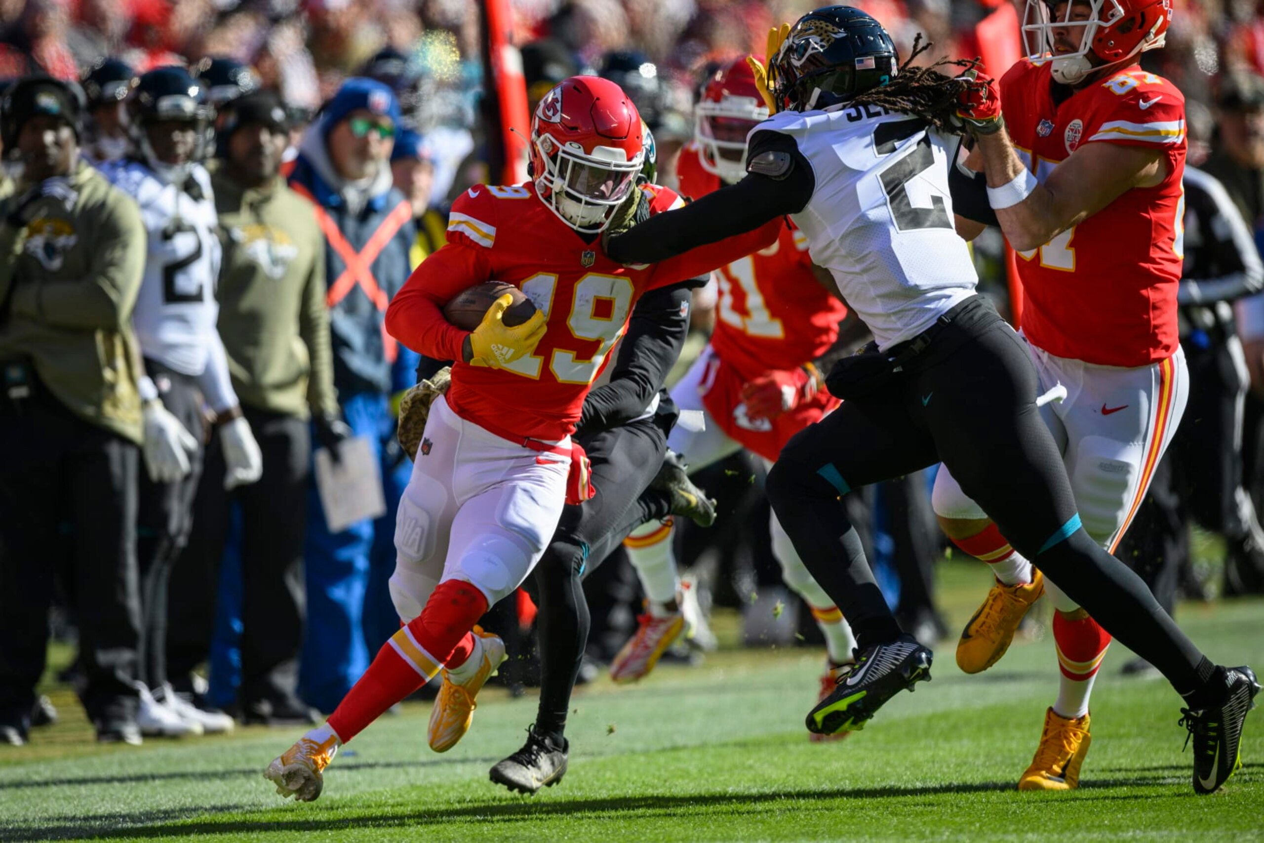 Jacksonville Jaguars safety Rayshawn Jenkins (2) tackles Kansas City Chiefs wide receiver Kadarius Toney (19) during the first half of an NFL football game, Sunday, Nov. 13, 2022 in Kansas City, Mo. (AP Photo/Reed Hoffmann)