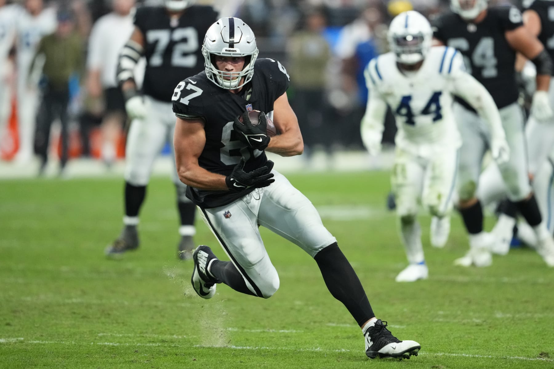 Las Vegas Raiders tight end Foster Moreau (87) runs the ball against the Indianapolis Colts during an NFL football game, Sunday, Nov. 13, 2022, in Las Vegas. (AP Photo/Matt York)