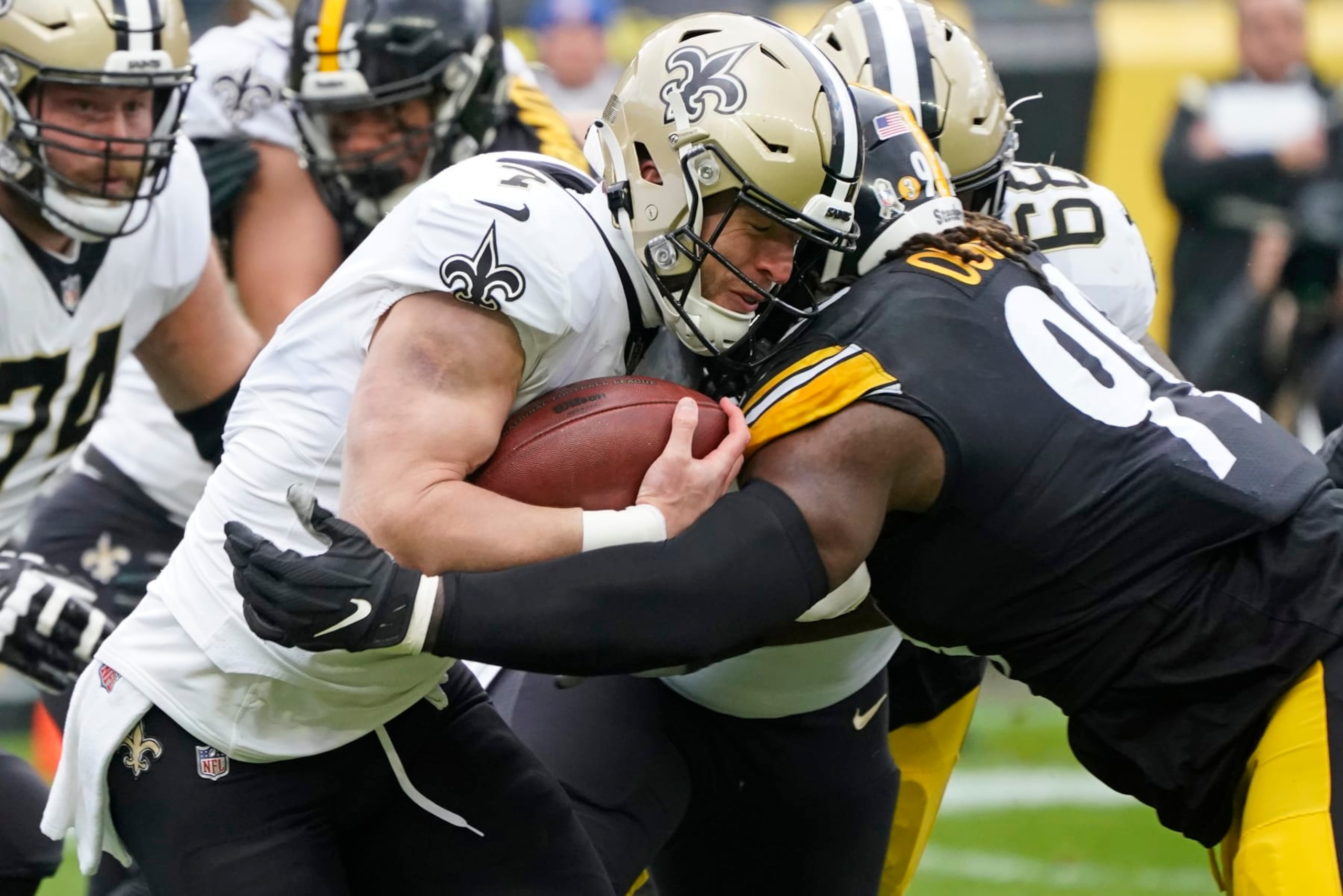 New Orleans Saints tight end Taysom Hill (7) is tackled by Pittsburgh Steelers defensive tackle Larry Ogunjobi (99) during the first half of an NFL football game in Pittsburgh, Sunday, Nov. 13, 2022. (AP Photo/Keith Srakocic) New Orleans Saints tight end Taysom Hill (7) is tackled by Pittsburgh Steelers defensive tackle Larry Ogunjobi (99) during the first half of an NFL football game in Pittsburgh, Sunday, Nov. 13, 2022. (AP Photo/Keith Srakocic)