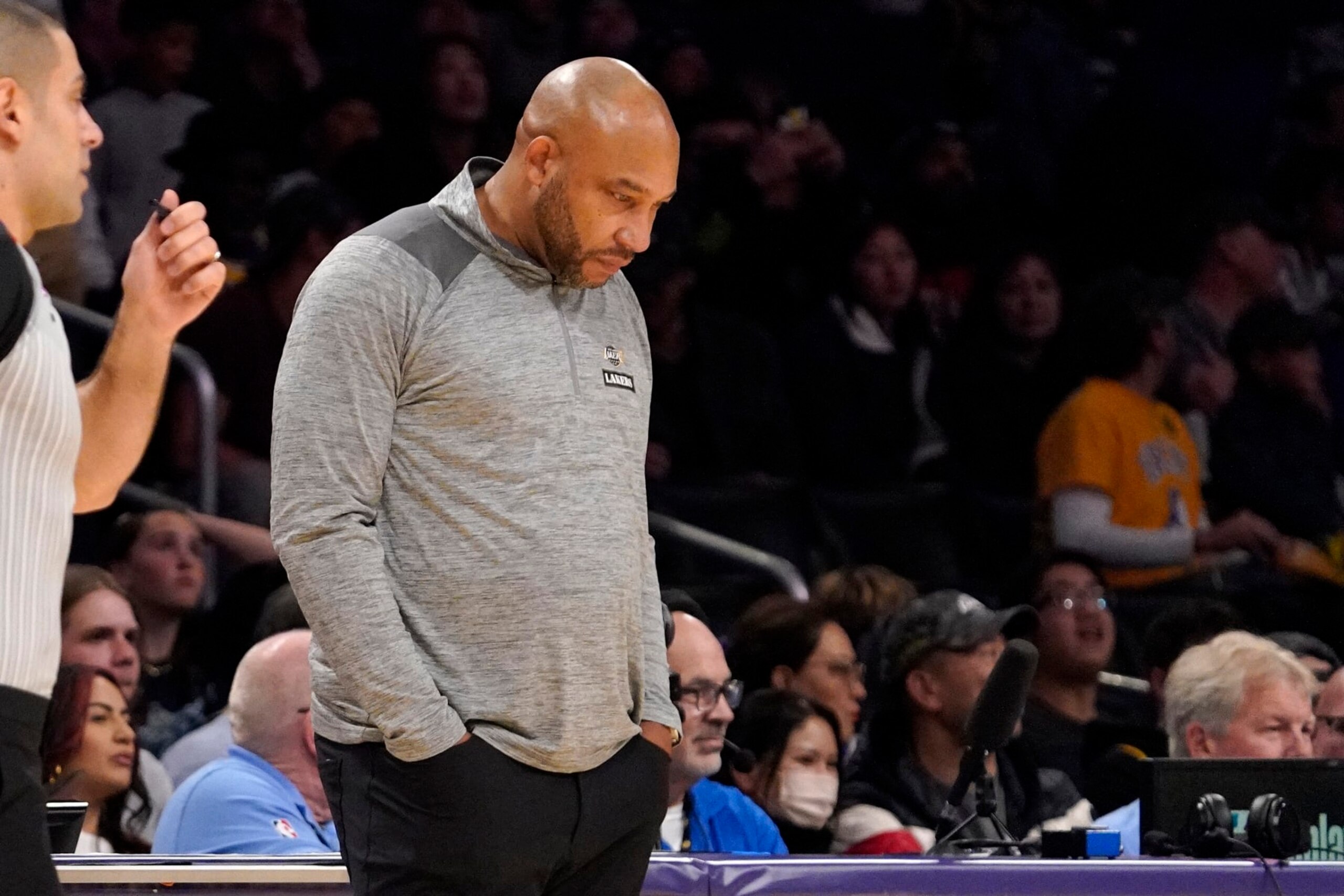 Los Angeles Lakers head coach Darvin Ham looks down at the ground in the closing seconds in the second half of an NBA basketball game against the Sacramento Kings Friday, Nov. 11, 2022, in Los Angeles. (AP Photo/Mark J. Terrill)