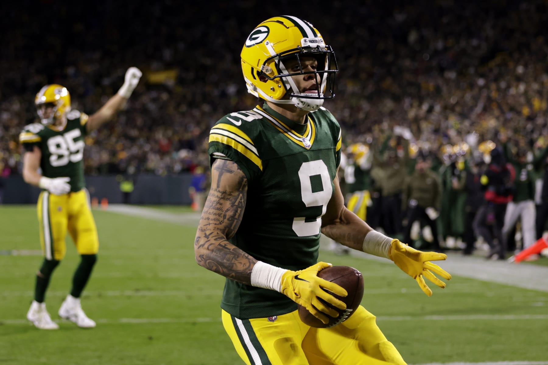 Green Bay Packers wide receiver Christian Watson (9) celebrates catching a touchdown pass during the second half of an NFL football game against the Dallas Cowboys Sunday, Nov. 13, 2022, in Green Bay, Wis. (AP Photo/Matt Ludtke) Green Bay Packers wide receiver Christian Watson (9) celebrates catching a touchdown pass during the second half of an NFL football game against the Dallas Cowboys Sunday, Nov. 13, 2022, in Green Bay, Wis. (AP Photo/Matt Ludtke)