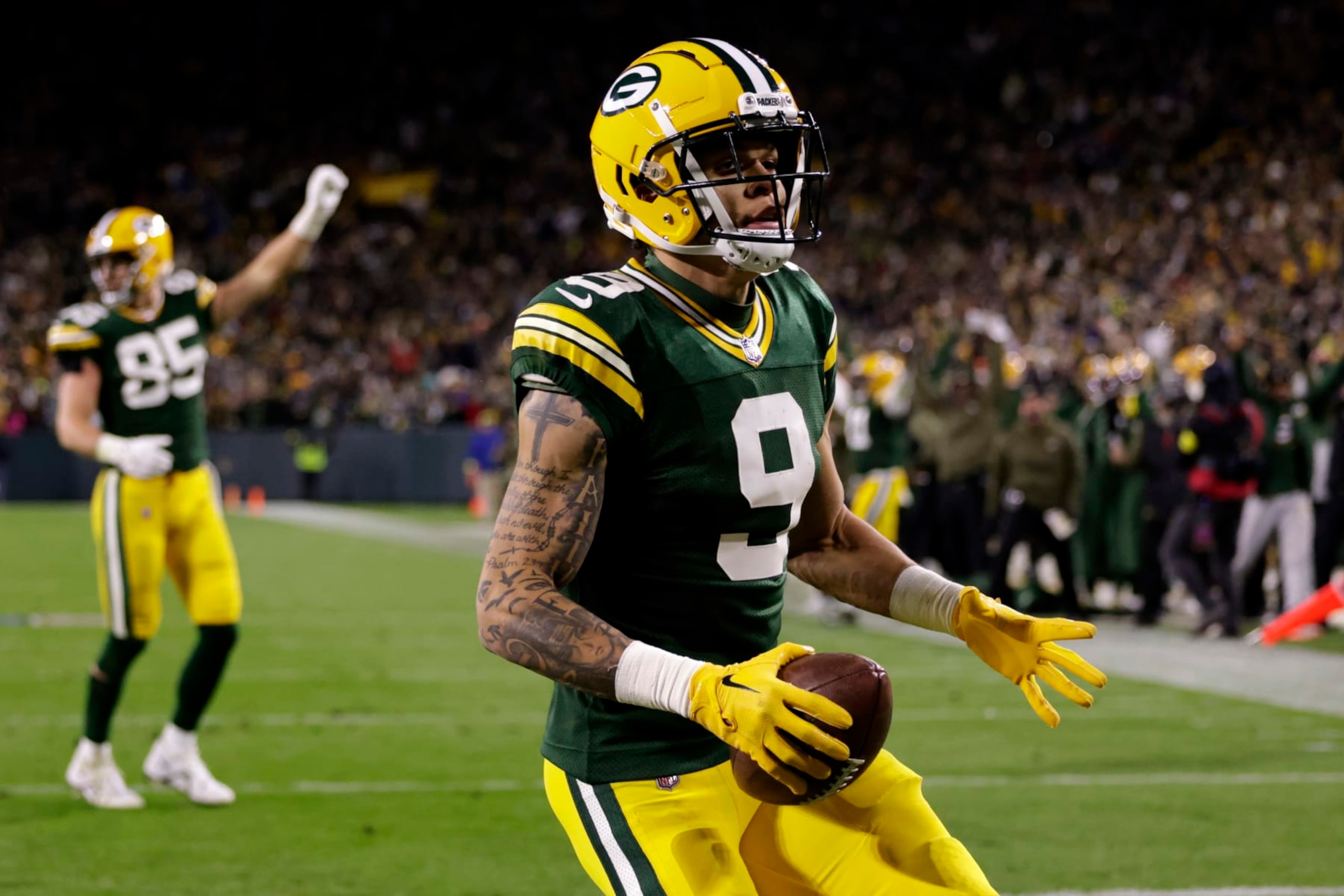 Green Bay Packers wide receiver Christian Watson (9) celebrates catching a touchdown pass during the second half of an NFL football game against the Dallas Cowboys Sunday, Nov. 13, 2022, in Green Bay, Wis. (AP Photo/Matt Ludtke) Green Bay Packers wide receiver Christian Watson (9) celebrates catching a touchdown pass during the second half of an NFL football game against the Dallas Cowboys Sunday, Nov. 13, 2022, in Green Bay, Wis. (AP Photo/Matt Ludtke)
