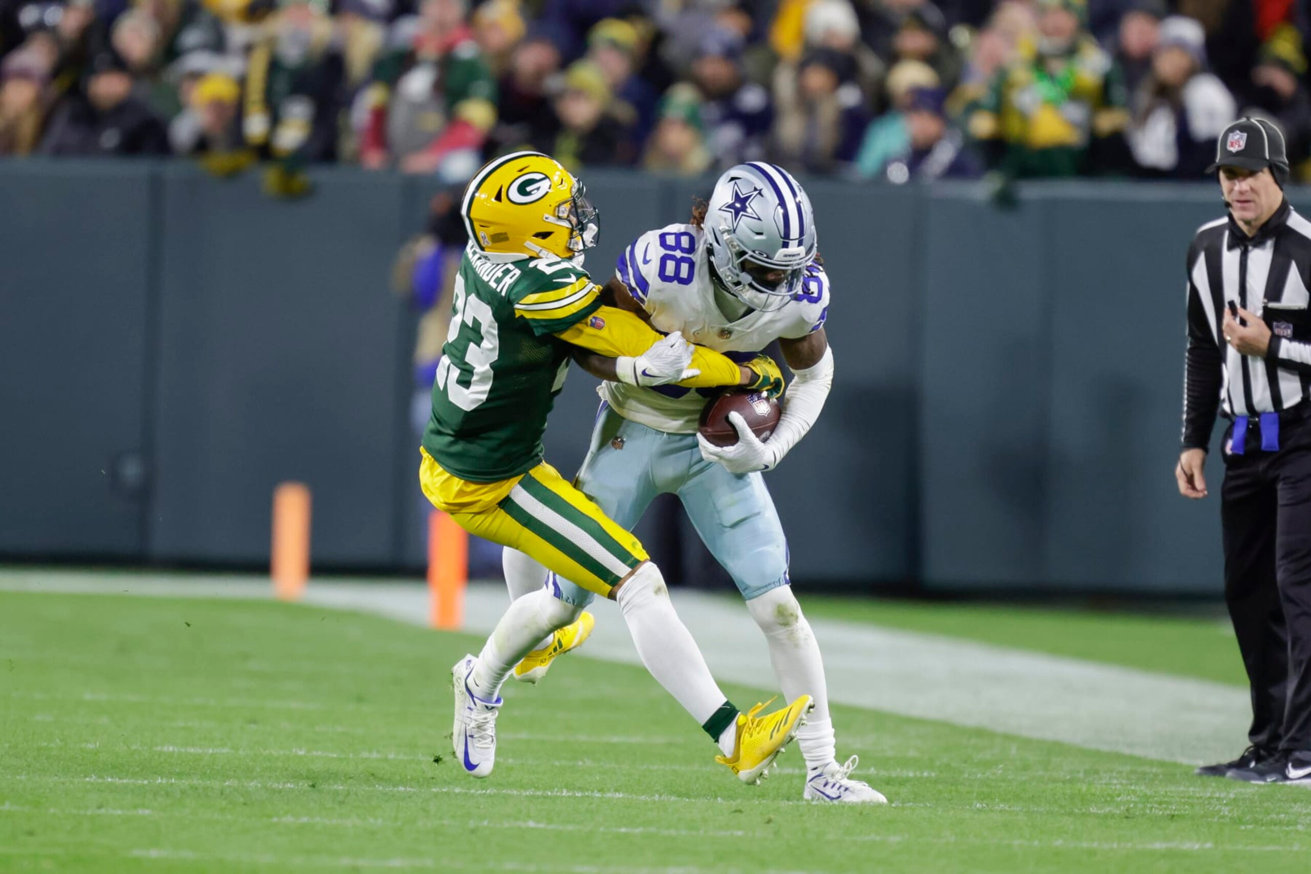 Dallas Cowboys wide receiver CeeDee Lamb (88) is hit after making a catch by Green Bay Packers cornerback Jaire Alexander (23) during an NFL football game Sunday, Nov. 13, 2022, in Green Bay, Wis. (AP Photo/Matt Ludtke) Dallas Cowboys wide receiver CeeDee Lamb (88) is hit after making a catch by Green Bay Packers cornerback Jaire Alexander (23) during an NFL football game Sunday, Nov. 13, 2022, in Green Bay, Wis. (AP Photo/Matt Ludtke)