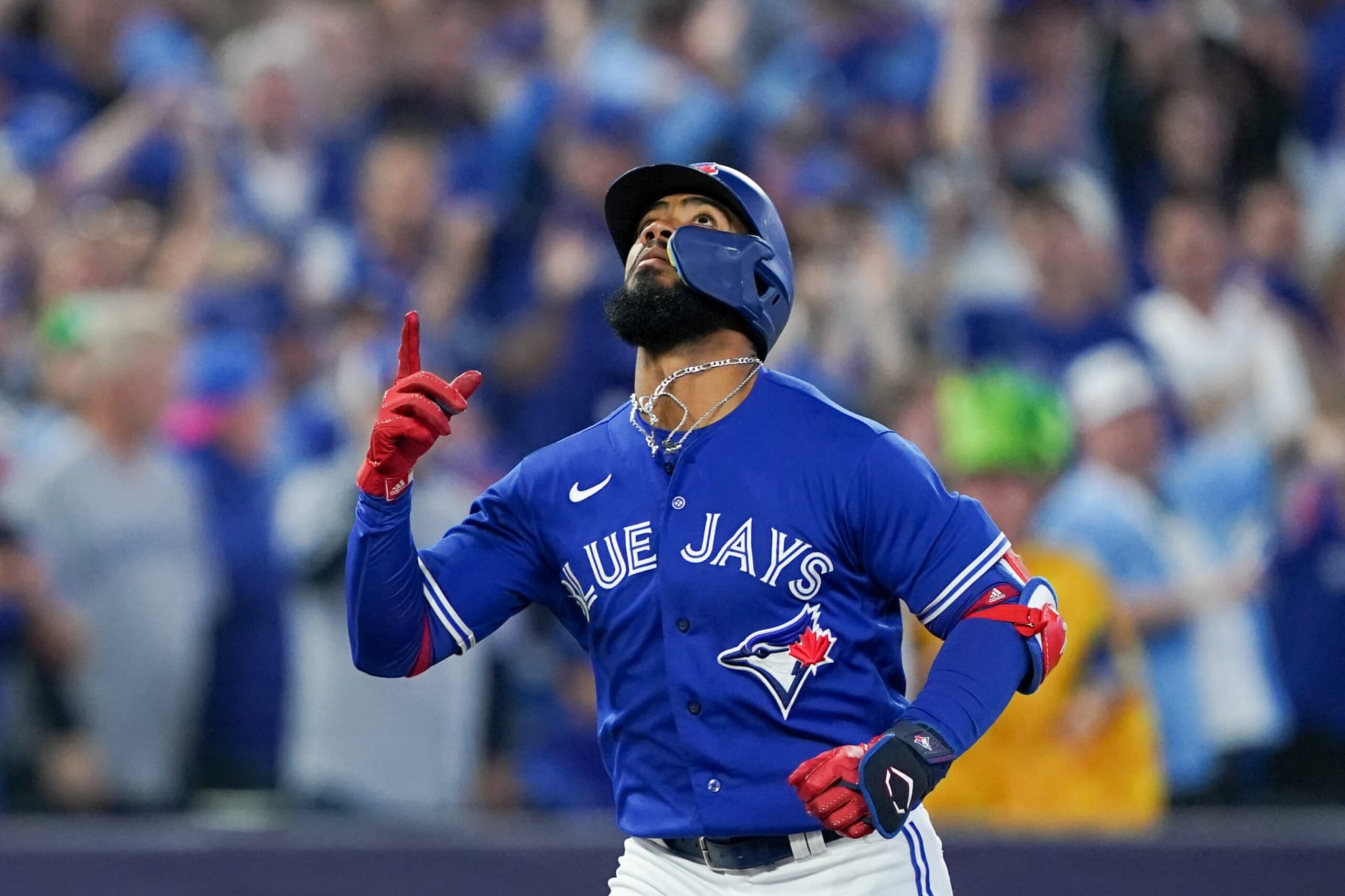 TORONTO,  - OCTOBER 08:   Teoscar Hernandez #37 of the Toronto Blue Jays reacts while running the bases after hitting a two-run home run in the second inning during the Wild Card Series game between the Seattle Mariners and the Toronto Blue Jays at Rogers Centre on Saturday, October 8, 2022 in Toronto, Canada. (Photo by Thomas Skrlj/MLB Photos via Getty Images)