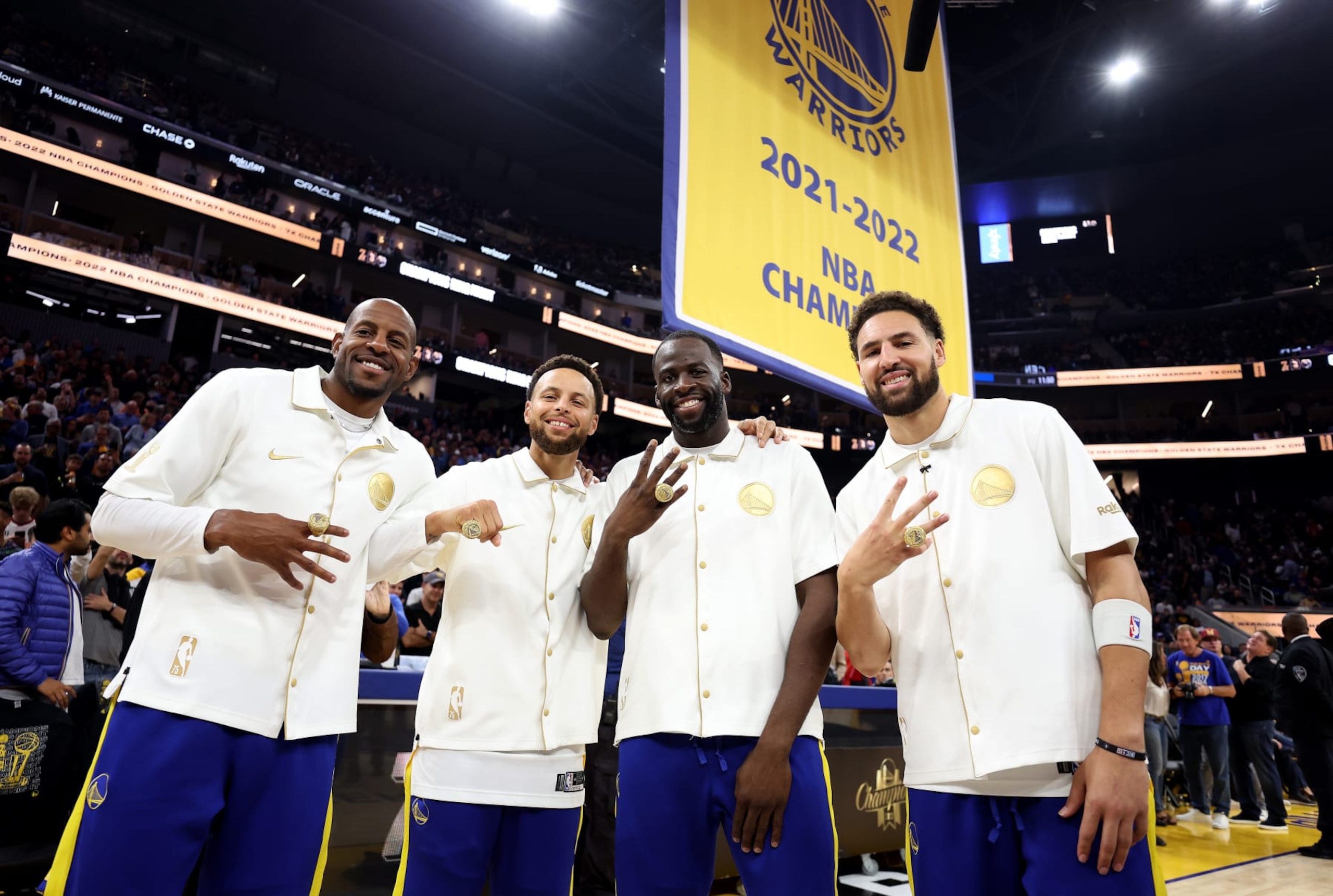 SAN FRANCISCO, CALIFORNIA - OCTOBER 18: Andre Iguodala #9, Stephen Curry #30, Draymond Green #23, and Klay Thompson #11 of the Golden State Warriors pose with their championship rings in front of a championship banner during a ceremony prior to the game against the Los Angeles Lakers at Chase Center on October 18, 2022 in San Francisco, California. NOTE TO USER: User expressly acknowledges and agrees that, by downloading and or using this photograph, User is consenting to the terms and conditions of the Getty Images License Agreement. (Photo by Ezra Shaw/Getty Images) SAN FRANCISCO, CALIFORNIA - OCTOBER 18: Andre Iguodala #9, Stephen Curry #30, Draymond Green #23, and Klay Thompson #11 of the Golden State Warriors pose with their championship rings in front of a championship banner during a ceremony prior to the game against the Los Angeles Lakers at Chase Center on October 18, 2022 in San Francisco, California. NOTE TO USER: User expressly acknowledges and agrees that, by downloading and or using this photograph, User is consenting to the terms and conditions of the Getty Images License Agreement. (Photo by Ezra Shaw/Getty Images)