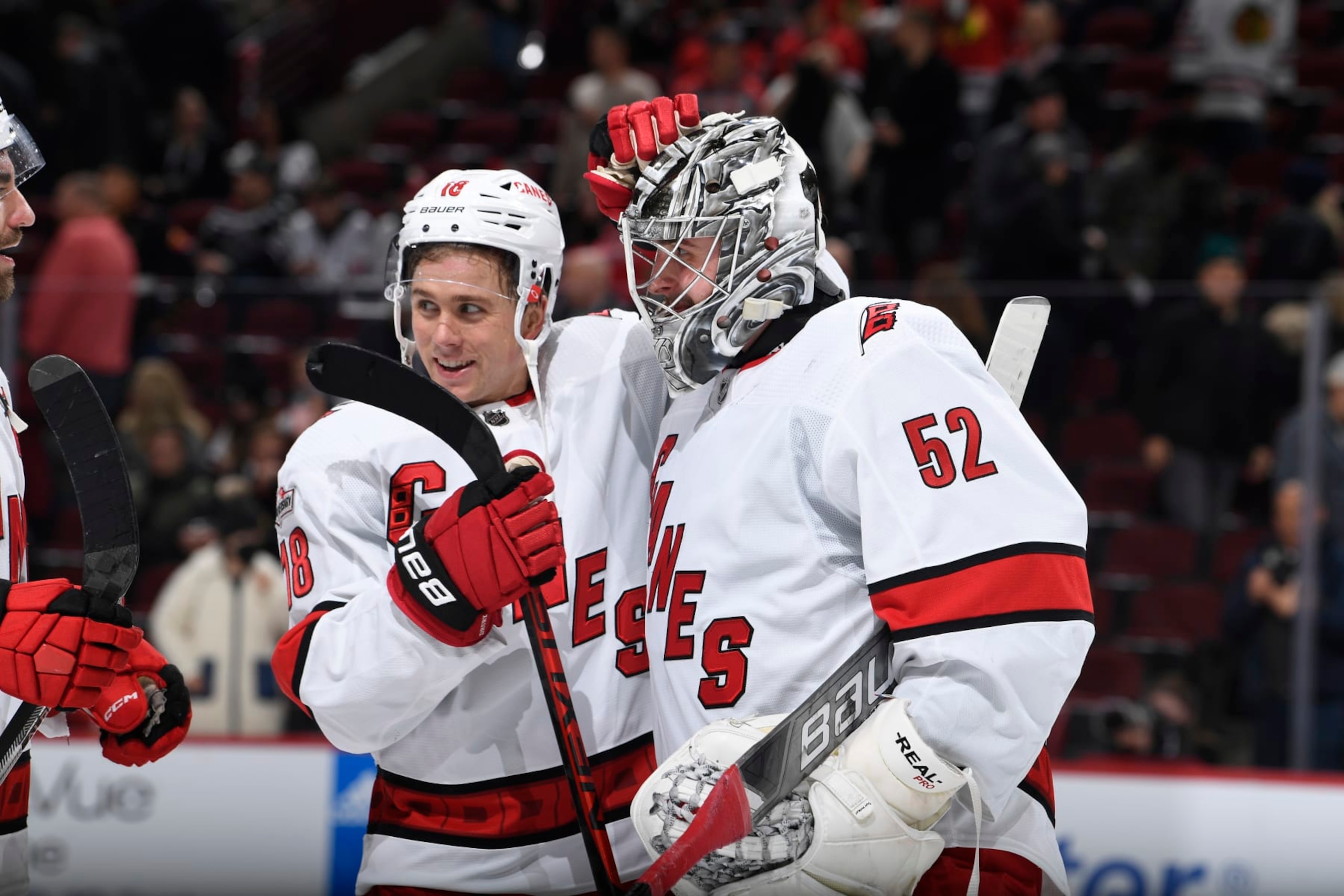 CHICAGO, ILLINOIS - NOVEMBER 14: Goalie Pyotr Kochetkov #52 and Jack Drury #18 of the Carolina Hurricanes celebrate after Kochetkov made 27 saves for his first career shutout. The Carolina Hurricanes beat the Chicago Blackhawks 3-0 at United Center on November 14, 2022 in Chicago, Illinois. (Photo by Bill Smith/NHLI via Getty Images) CHICAGO, ILLINOIS - NOVEMBER 14: Goalie Pyotr Kochetkov #52 and Jack Drury #18 of the Carolina Hurricanes celebrate after Kochetkov made 27 saves for his first career shutout. The Carolina Hurricanes beat the Chicago Blackhawks 3-0 at United Center on November 14, 2022 in Chicago, Illinois. (Photo by Bill Smith/NHLI via Getty Images)