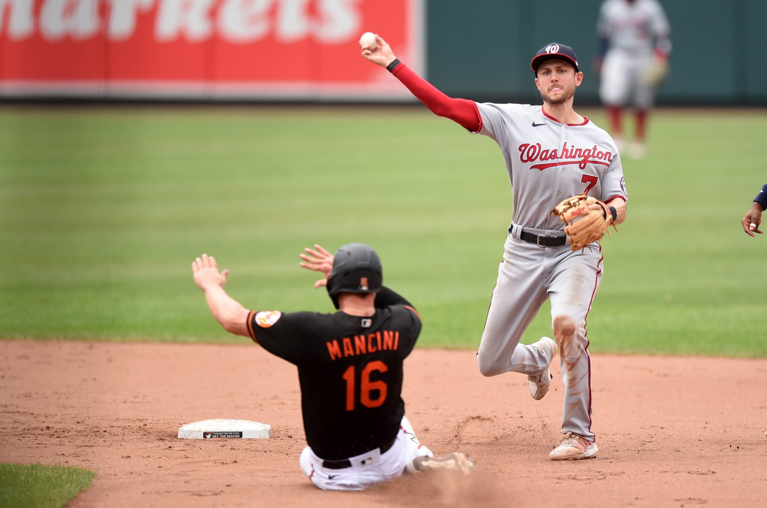 BALTIMORE, MARYLAND - JULY 25: Trea Turner #7 of the Washington Nationals forces out Trey Mancini #16 of the Baltimore Orioles to start a double play in the eighth inning at Oriole Park at Camden Yards on July 25, 2021 in Baltimore, Maryland. (Photo by Greg Fiume/Getty Images)