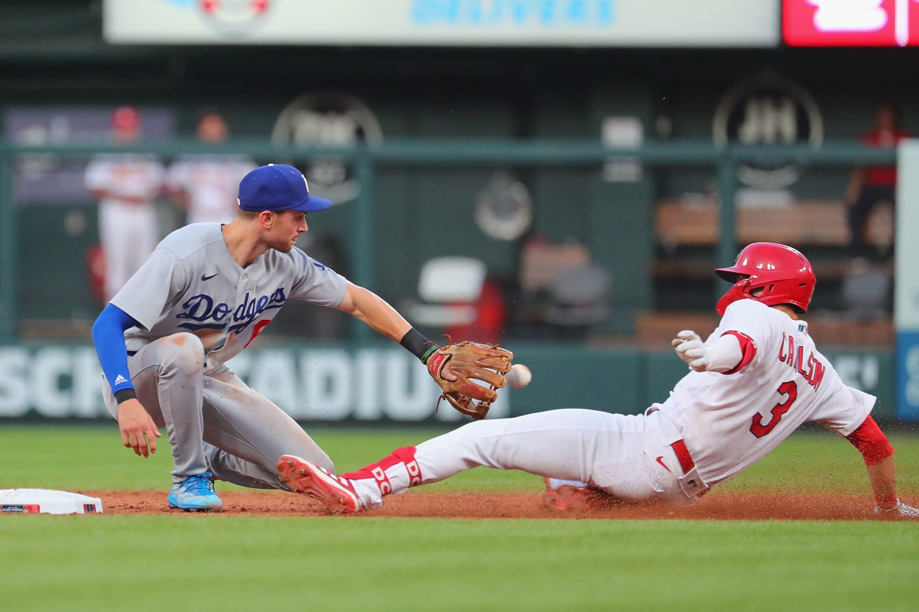 ST LOUIS, MO - JULY 14: Dylan Carlson #3 of the St. Louis Cardinals is thrown out at second base against Trea Turner #6 of the Los Angeles Dodgers in the sixth inning at Busch Stadium on July 14, 2022 in St Louis, Missouri. (Photo by Dilip Vishwanat/Getty Images)