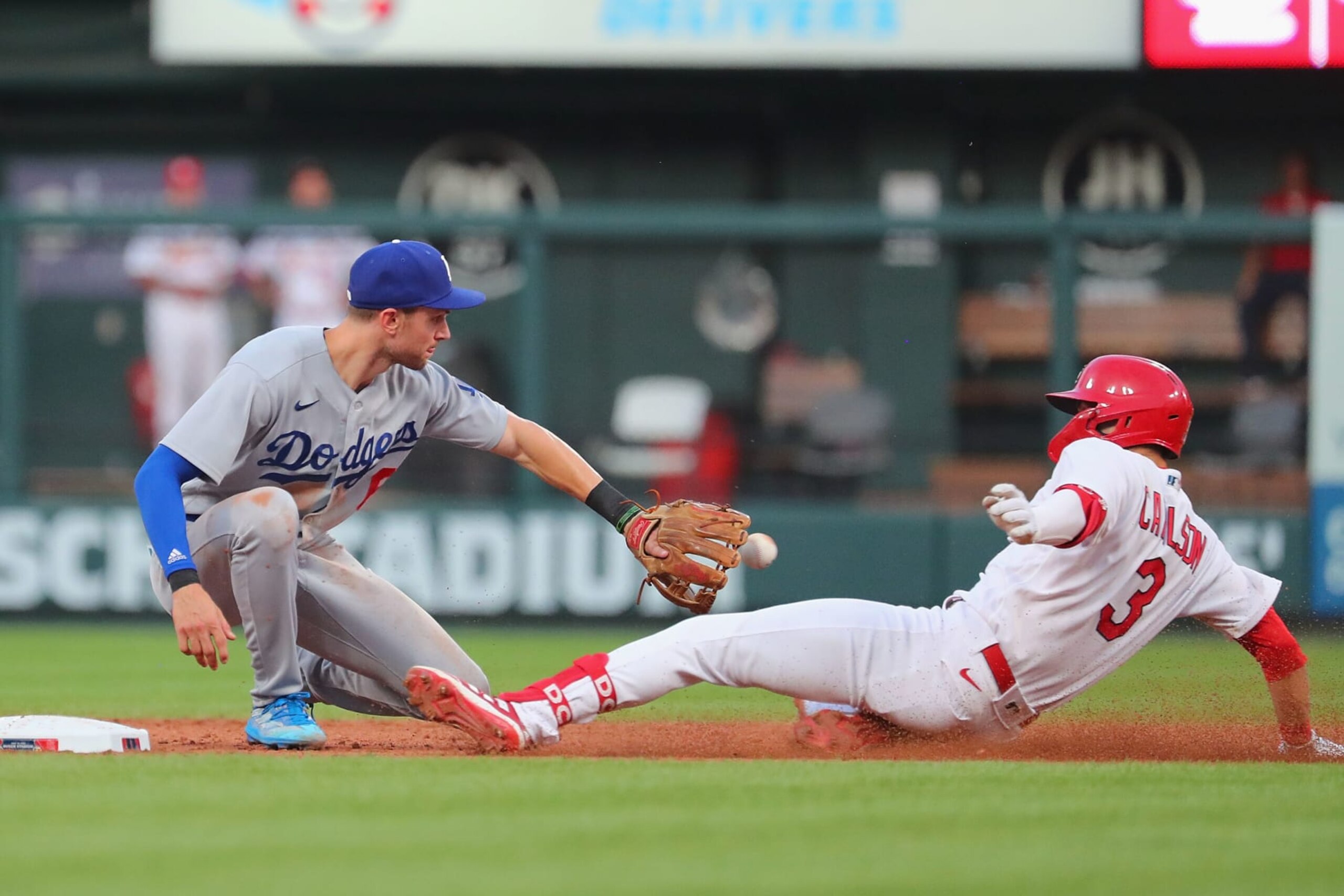 ST LOUIS, MO - JULY 14: Dylan Carlson #3 of the St. Louis Cardinals is thrown out at second base against Trea Turner #6 of the Los Angeles Dodgers in the sixth inning at Busch Stadium on July 14, 2022 in St Louis, Missouri. (Photo by Dilip Vishwanat/Getty Images)