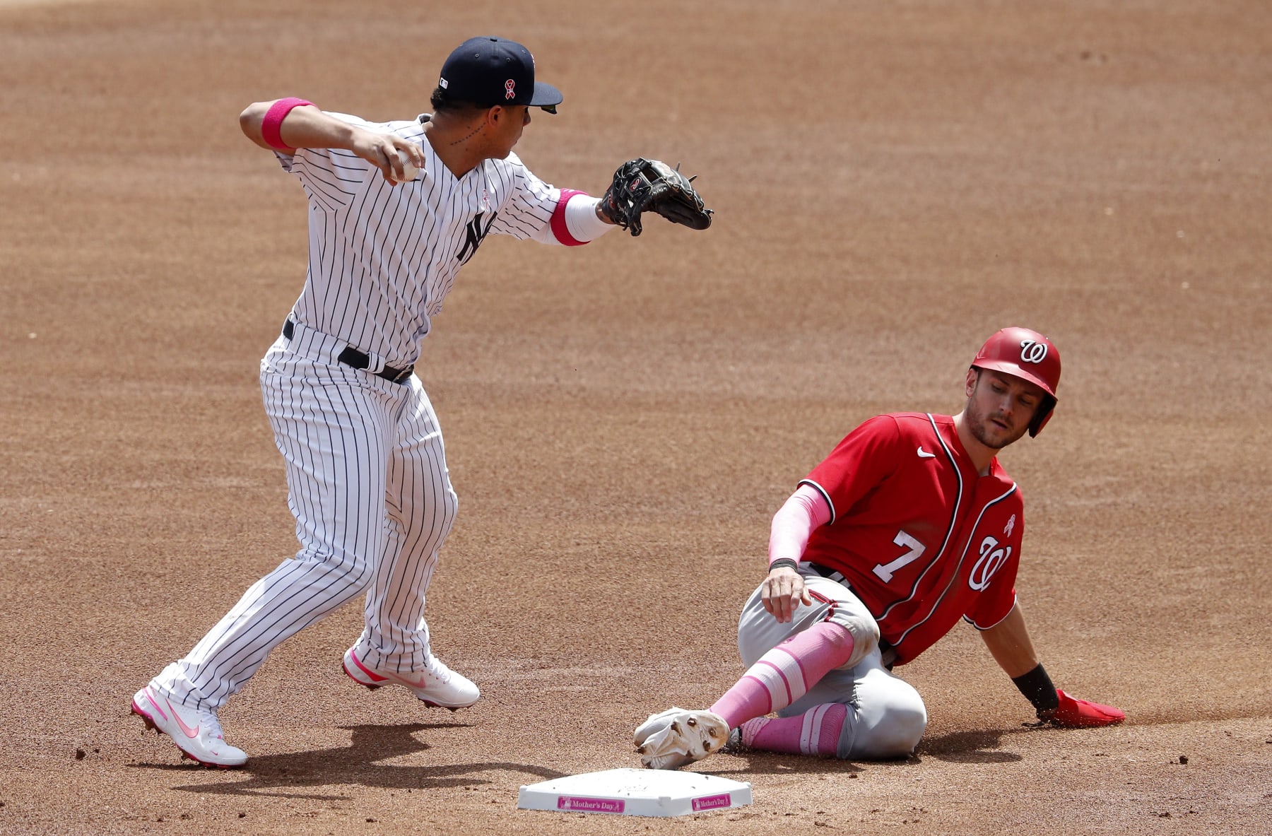NEW YORK, NEW YORK - MAY 09: (NEW YORK DAILIES OUT)  Gleyber Torres #25 of the New York Yankees in action against Trea Turner #7 of the Washington Nationals at Yankee Stadium on May 09, 2021 in New York City. The Yankees defeated the Nationals 3-2. (Photo by Jim McIsaac/Getty Images)