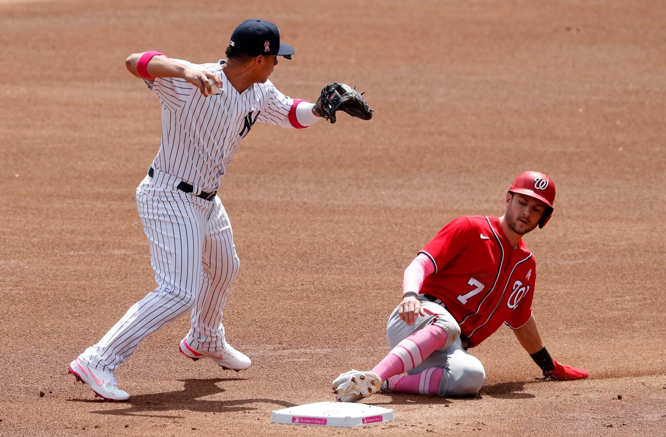 NEW YORK, NEW YORK - MAY 09: (NEW YORK DAILIES OUT)  Gleyber Torres #25 of the New York Yankees in action against Trea Turner #7 of the Washington Nationals at Yankee Stadium on May 09, 2021 in New York City. The Yankees defeated the Nationals 3-2. (Photo by Jim McIsaac/Getty Images)