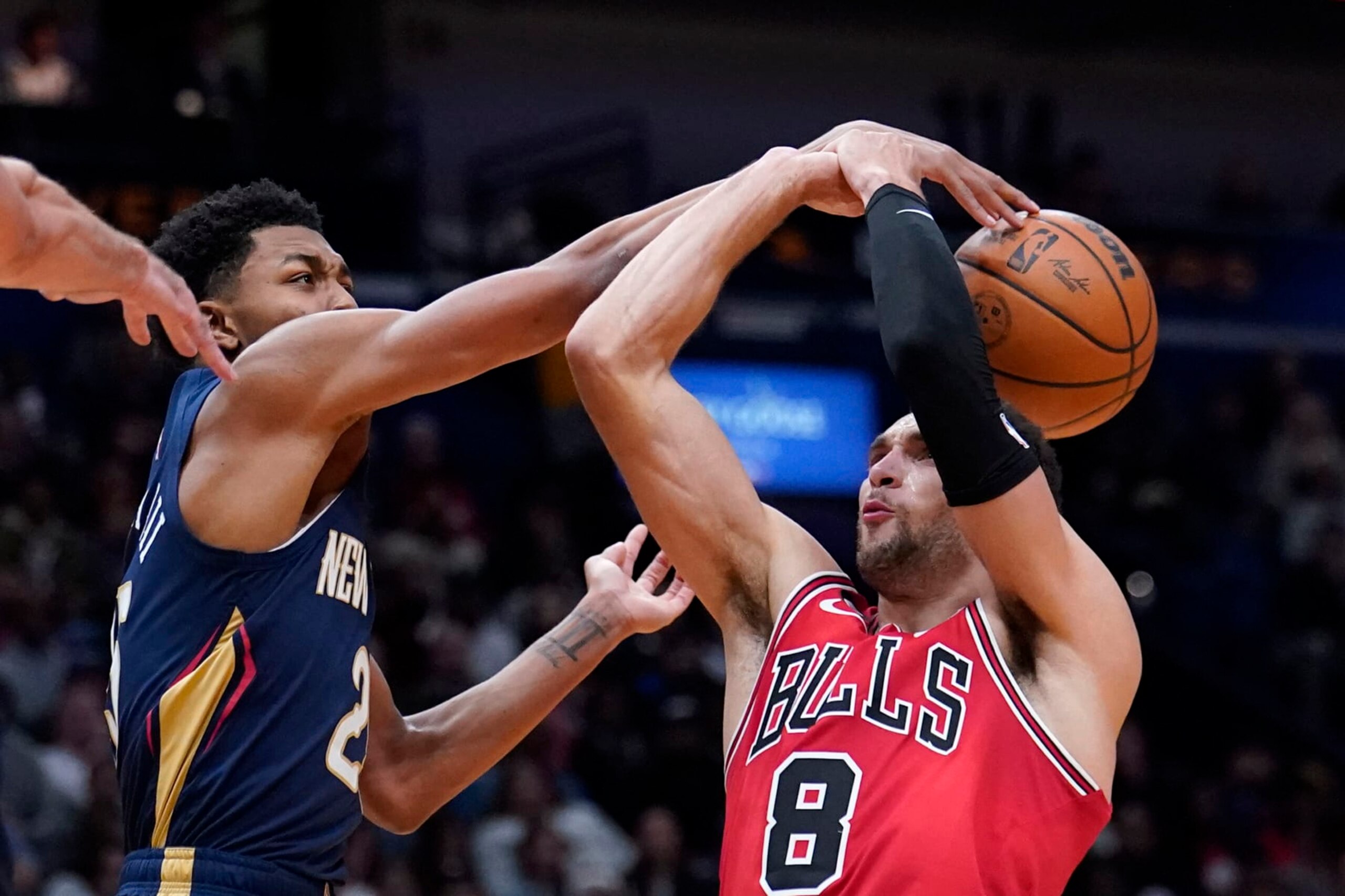 New Orleans Pelicans guard Trey Murphy III (25) blocks a shot by Chicago Bulls guard Zach LaVine (8) in the first half of an NBA basketball game in New Orleans, Wednesday, Nov. 16, 2022. (AP Photo/Gerald Herbert)