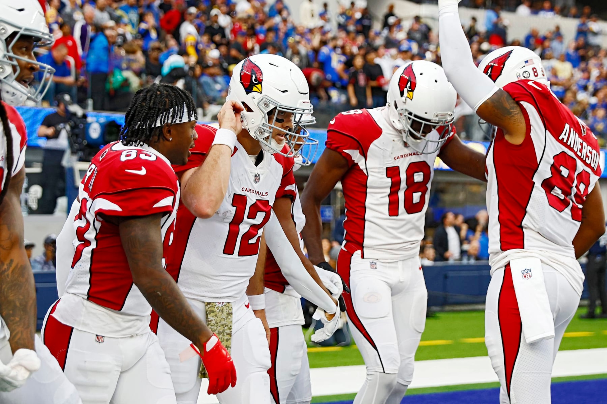 INGLEWOOD, CALIFORNIA - NOVEMBER 13: Colt McCoy #12 of the Arizona Cardinals celebrates with teammates after a touchdown in the second quarter of the game against the Los Angeles Rams at SoFi Stadium on November 13, 2022 in Inglewood, California. (Photo by Ronald Martinez/Getty Images)