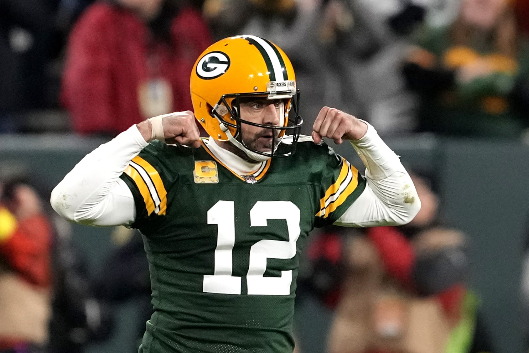 GREEN BAY, WISCONSIN - NOVEMBER 13: Aaron Rodgers #12 of the Green Bay Packers celebrates after a play during overtime against the Dallas Cowboys at Lambeau Field on November 13, 2022 in Green Bay, Wisconsin. (Photo by Patrick McDermott/Getty Images)
