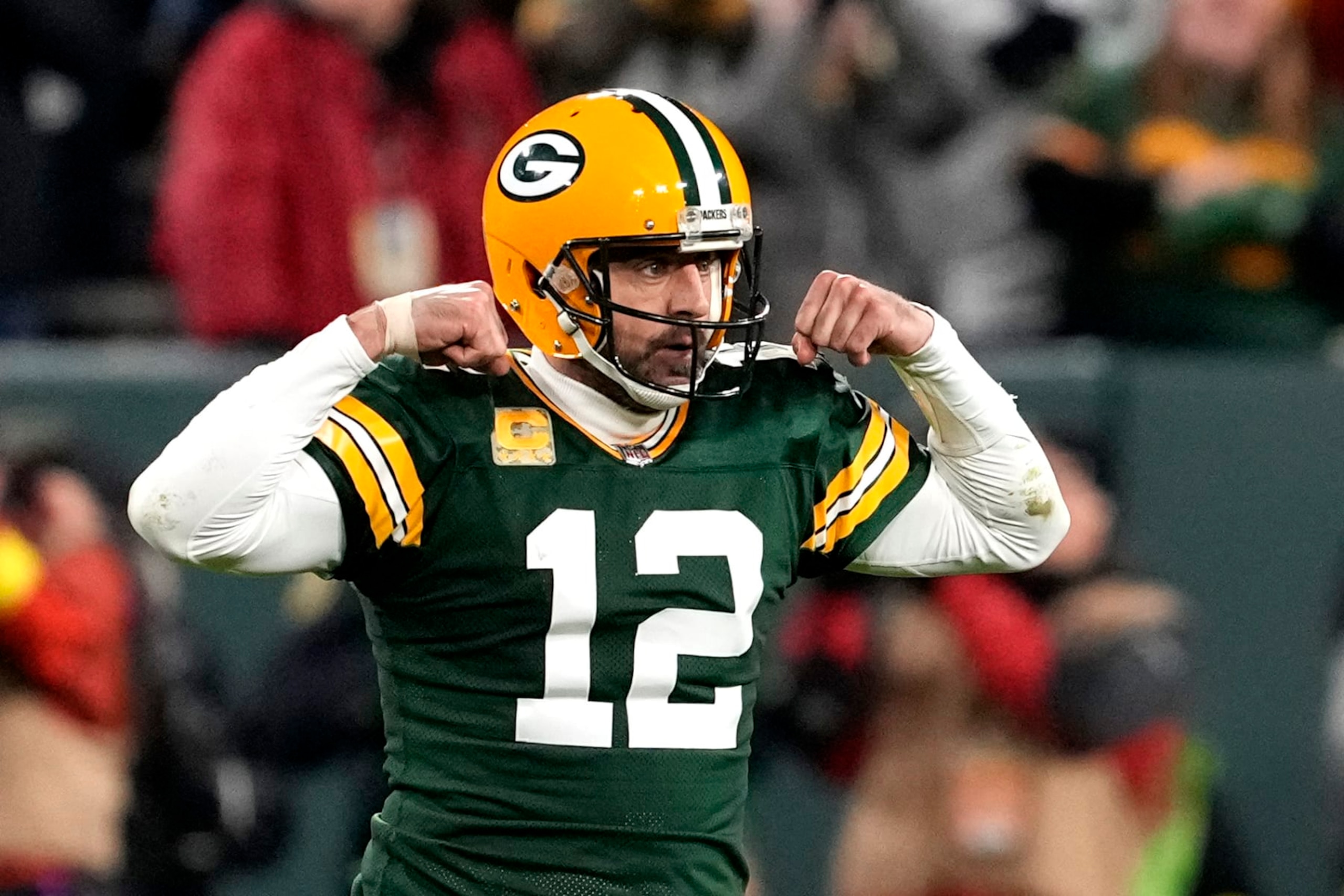 GREEN BAY, WISCONSIN - NOVEMBER 13: Aaron Rodgers #12 of the Green Bay Packers celebrates after a play during overtime against the Dallas Cowboys at Lambeau Field on November 13, 2022 in Green Bay, Wisconsin. (Photo by Patrick McDermott/Getty Images)