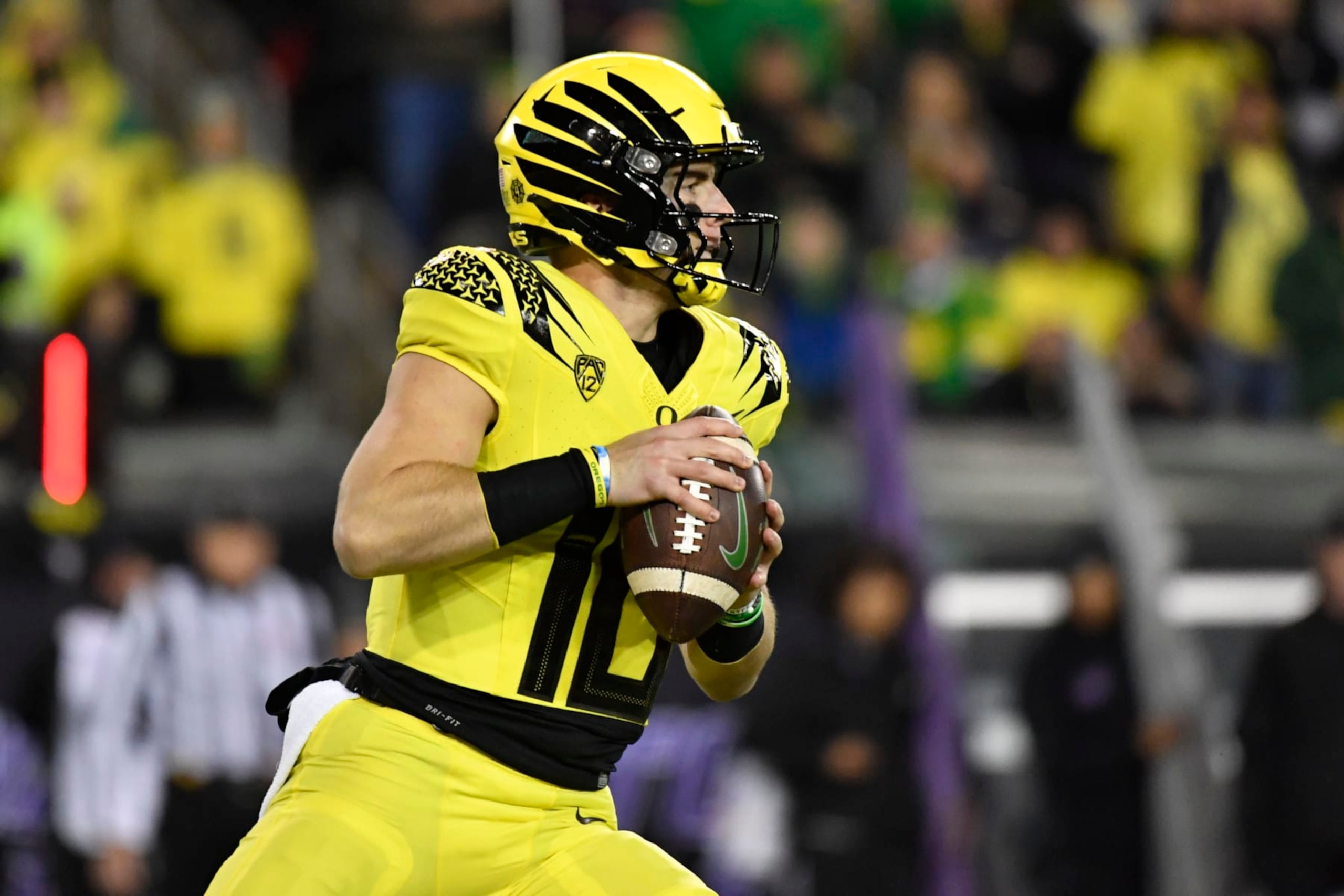 Oregon quarterback Bo Nix (10) looks to pass against Washington during the first half of an NCAA college football game Saturday, Nov. 12, 2022, in Eugene, Ore. (AP Photo/Andy Nelson) Oregon quarterback Bo Nix (10) looks to pass against Washington during the first half of an NCAA college football game Saturday, Nov. 12, 2022, in Eugene, Ore. (AP Photo/Andy Nelson)