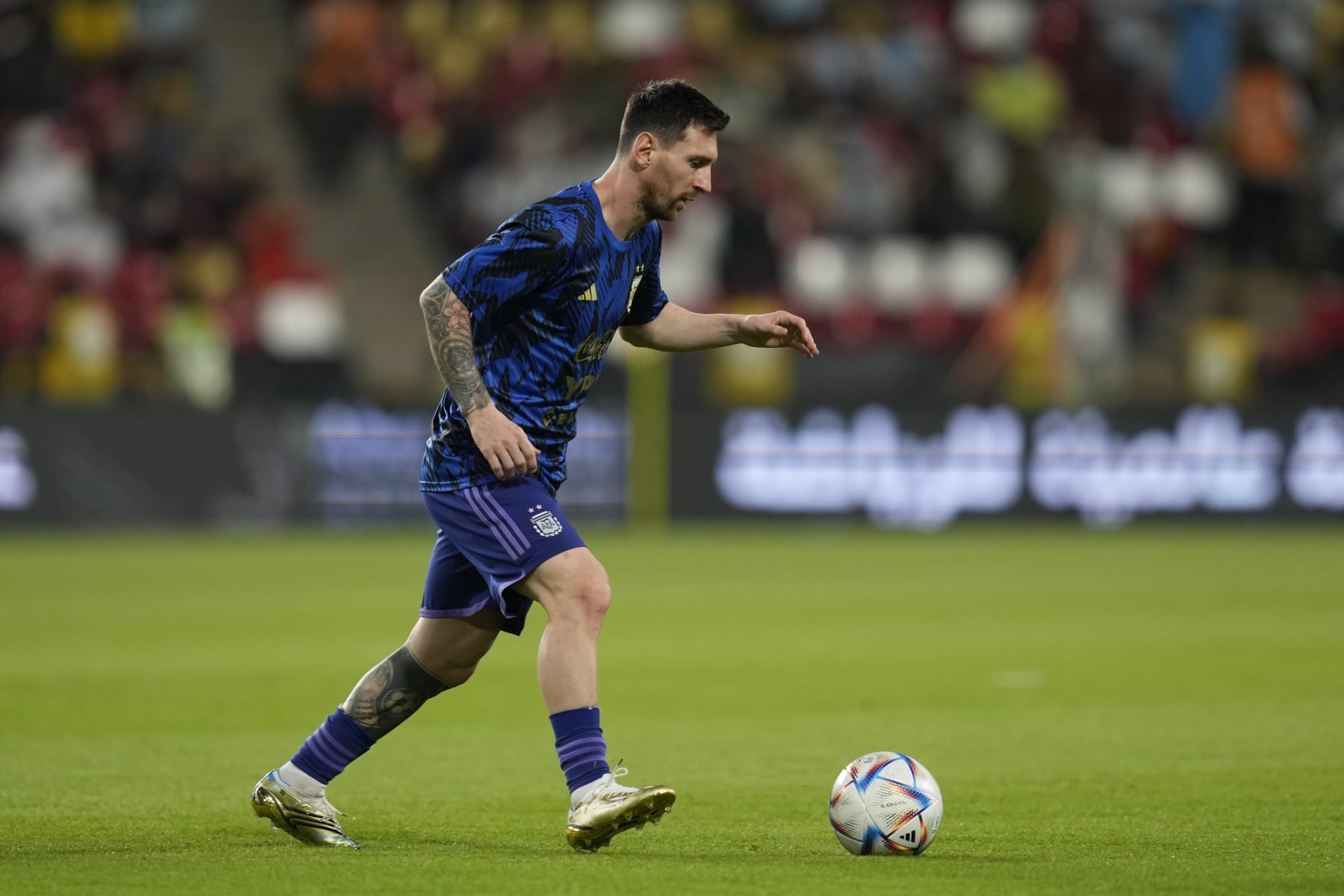 Argentina's Lionel Messi warms up before a friendly soccer match between Argentina and United Arab Emirates in Abu Dhabi, Wednesday, Nov. 16, 2022. (AP Photo/Kamran Jebreili)
