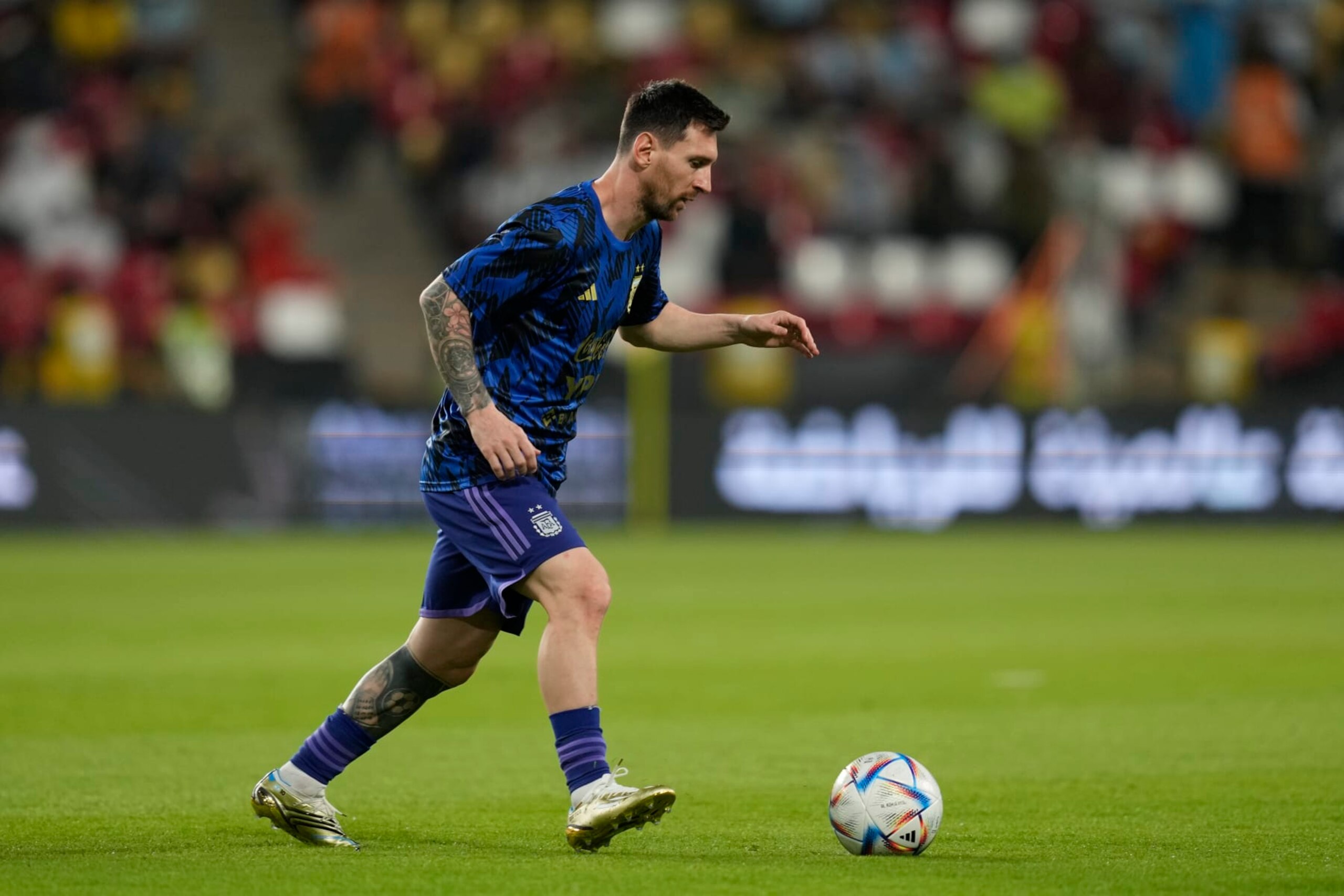 Argentina's Lionel Messi warms up before a friendly soccer match between Argentina and United Arab Emirates in Abu Dhabi, Wednesday, Nov. 16, 2022. (AP Photo/Kamran Jebreili)