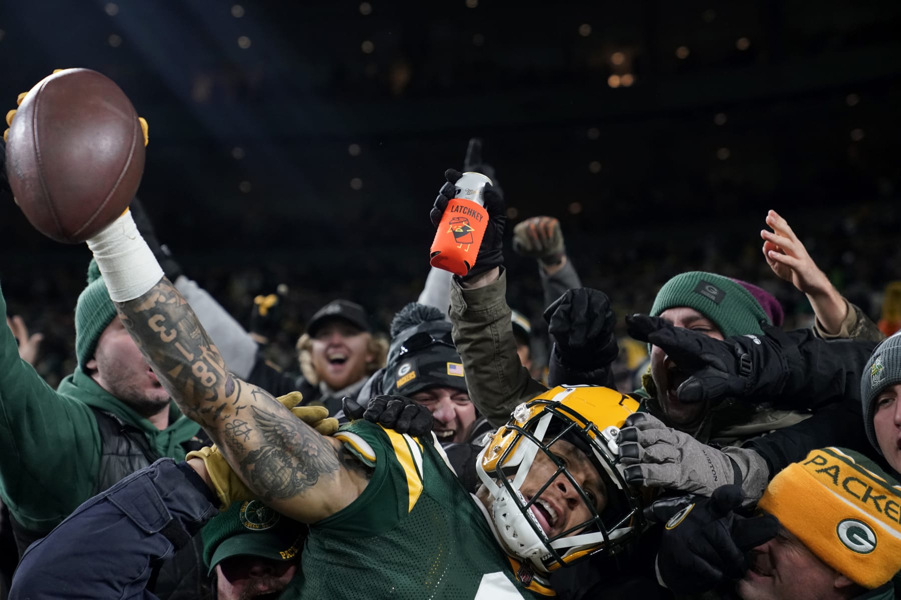 GREEN BAY, WISCONSIN - NOVEMBER 13: Christian Watson #9 of the Green Bay Packers celebrates with fans after scoring a touchdown during the fourth quarter against the Dallas Cowboys at Lambeau Field on November 13, 2022 in Green Bay, Wisconsin. (Photo by Patrick McDermott/Getty Images)