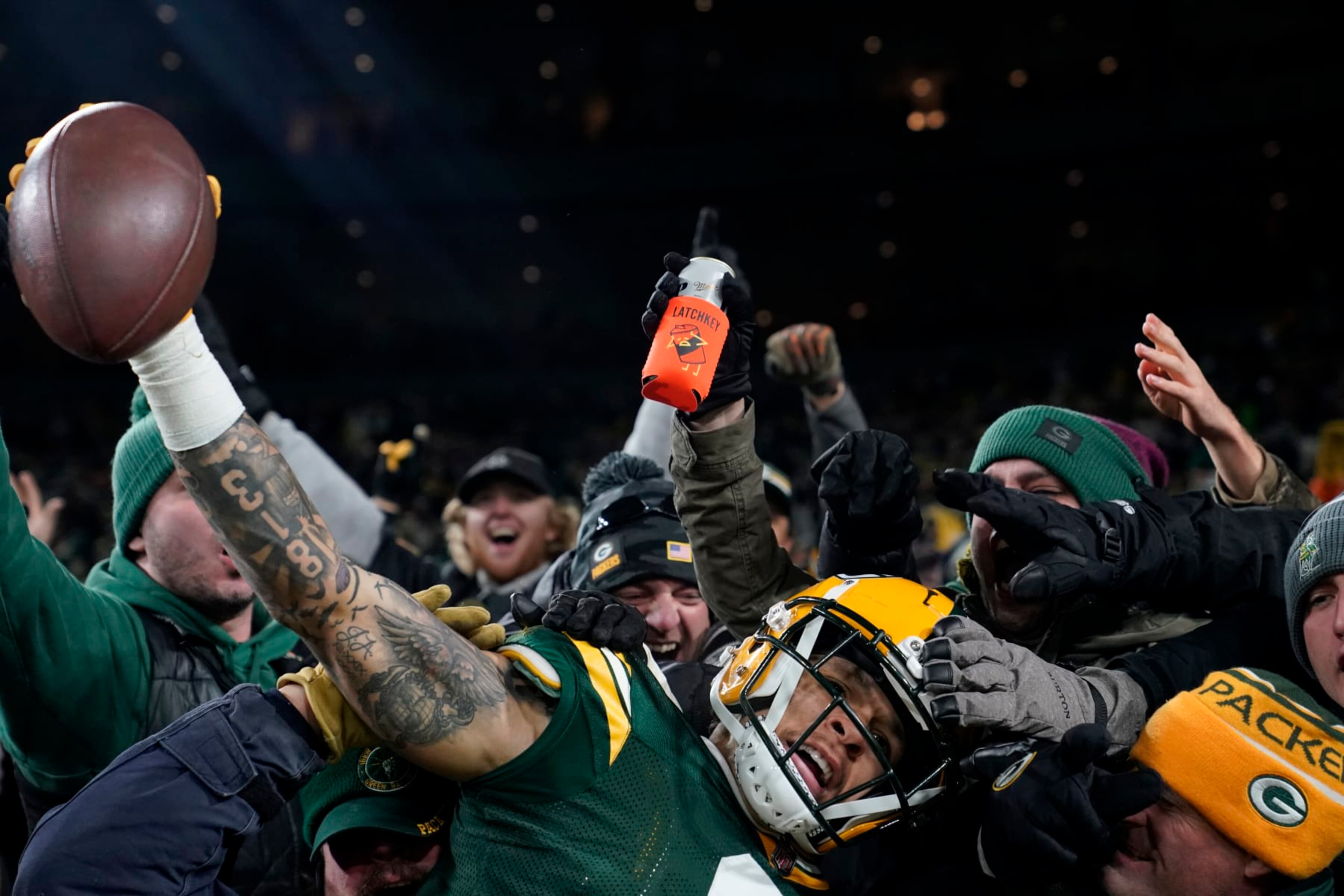 GREEN BAY, WISCONSIN - NOVEMBER 13: Christian Watson #9 of the Green Bay Packers celebrates with fans after scoring a touchdown during the fourth quarter against the Dallas Cowboys at Lambeau Field on November 13, 2022 in Green Bay, Wisconsin. (Photo by Patrick McDermott/Getty Images) GREEN BAY, WISCONSIN - NOVEMBER 13: Christian Watson #9 of the Green Bay Packers celebrates with fans after scoring a touchdown during the fourth quarter against the Dallas Cowboys at Lambeau Field on November 13, 2022 in Green Bay, Wisconsin. (Photo by Patrick McDermott/Getty Images)