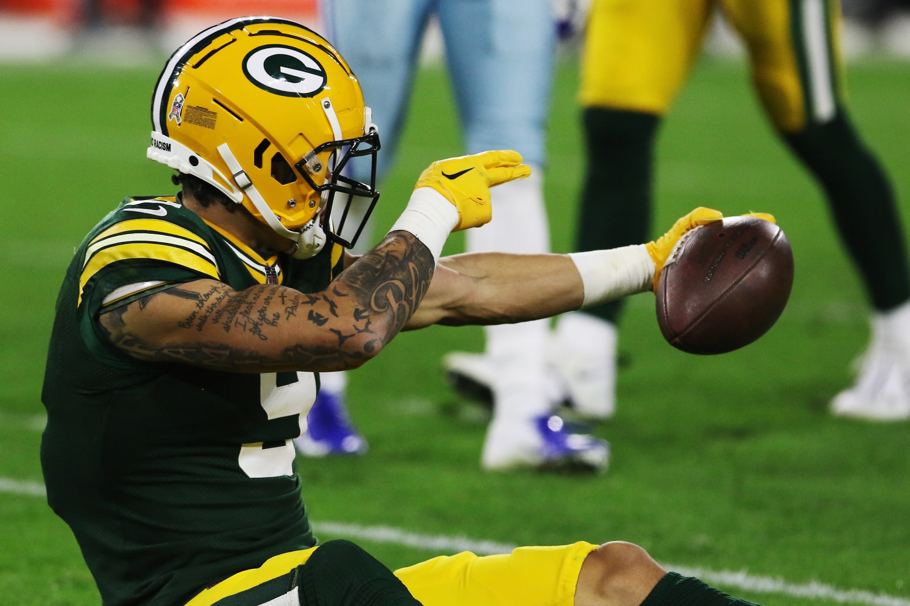 GREEN BAY, WI - NOVEMBER 13: Green Bay Packers wide receiver Christian Watson (9) celebrates a first down during a game between the Green Bay Packers and the Dallas Cowboys at Lambeau Field on November 13, 2022 in Green Bay, WI. (Photo by Larry Radloff/Icon Sportswire via Getty Images)