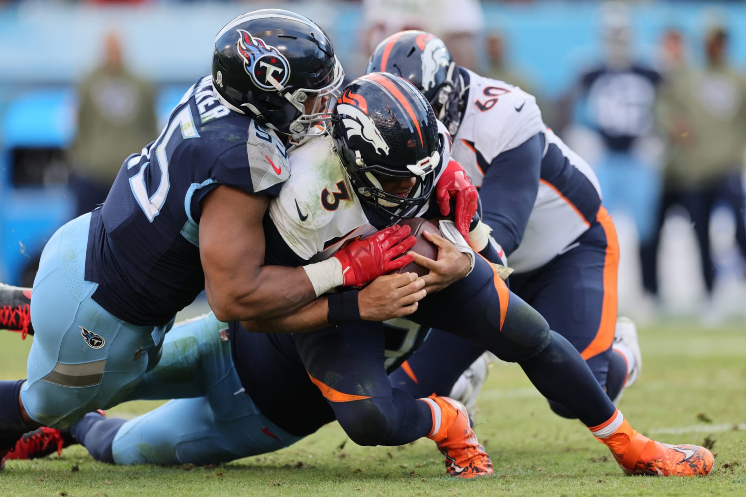 NASHVILLE, TENNESSEE - NOVEMBER 13: DeMarcus Walker #95 of the Tennessee Titans sacks Russell Wilson #3 of the Denver Broncos during the fourth quarter at Nissan Stadium on November 13, 2022 in Nashville, Tennessee. (Photo by Andy Lyons/Getty Images) NASHVILLE, TENNESSEE - NOVEMBER 13: DeMarcus Walker #95 of the Tennessee Titans sacks Russell Wilson #3 of the Denver Broncos during the fourth quarter at Nissan Stadium on November 13, 2022 in Nashville, Tennessee. (Photo by Andy Lyons/Getty Images)