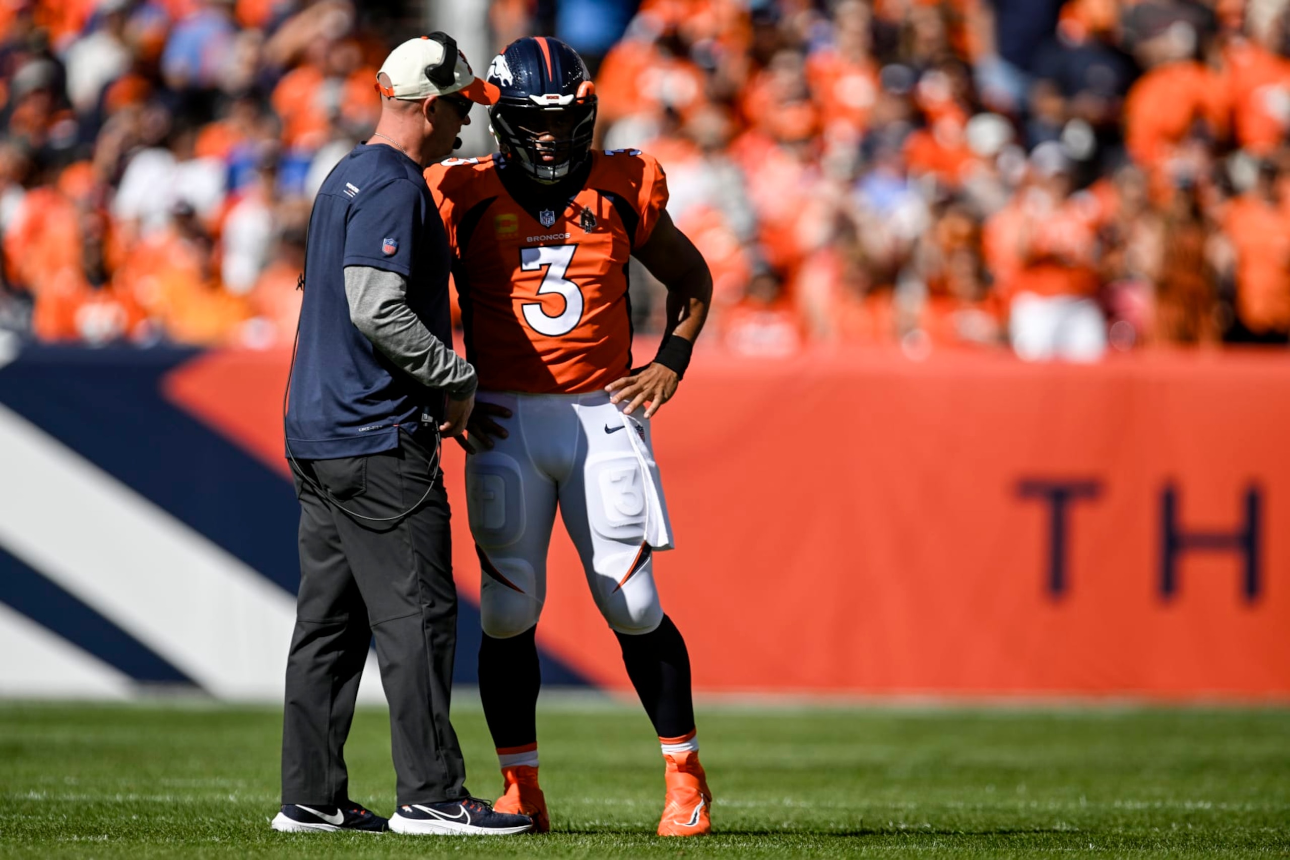 DENVER, CO - SEPTEMBER 18: Head coach Nathaniel Hackett of the Denver Broncos speaks to Russell Wilson (3) on the field during the first quarter against the Houston Texans at Empower Field at Mile High in Denver on Sunday, September 18, 2022. (Photo by AAron Ontiveroz/MediaNews Group/The Denver Post via Getty Images) DENVER, CO - SEPTEMBER 18: Head coach Nathaniel Hackett of the Denver Broncos speaks to Russell Wilson (3) on the field during the first quarter against the Houston Texans at Empower Field at Mile High in Denver on Sunday, September 18, 2022. (Photo by AAron Ontiveroz/MediaNews Group/The Denver Post via Getty Images)