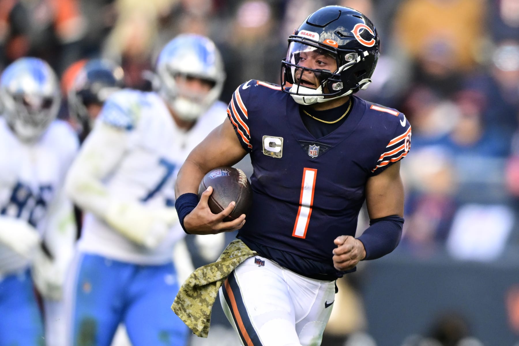 CHICAGO, ILLINOIS - NOVEMBER 13: Justin Fields #1 of the Chicago Bears scores a touchdown during the fourth quarter against the Detroit Lions at Soldier Field on November 13, 2022 in Chicago, Illinois. (Photo by Quinn Harris/Getty Images)