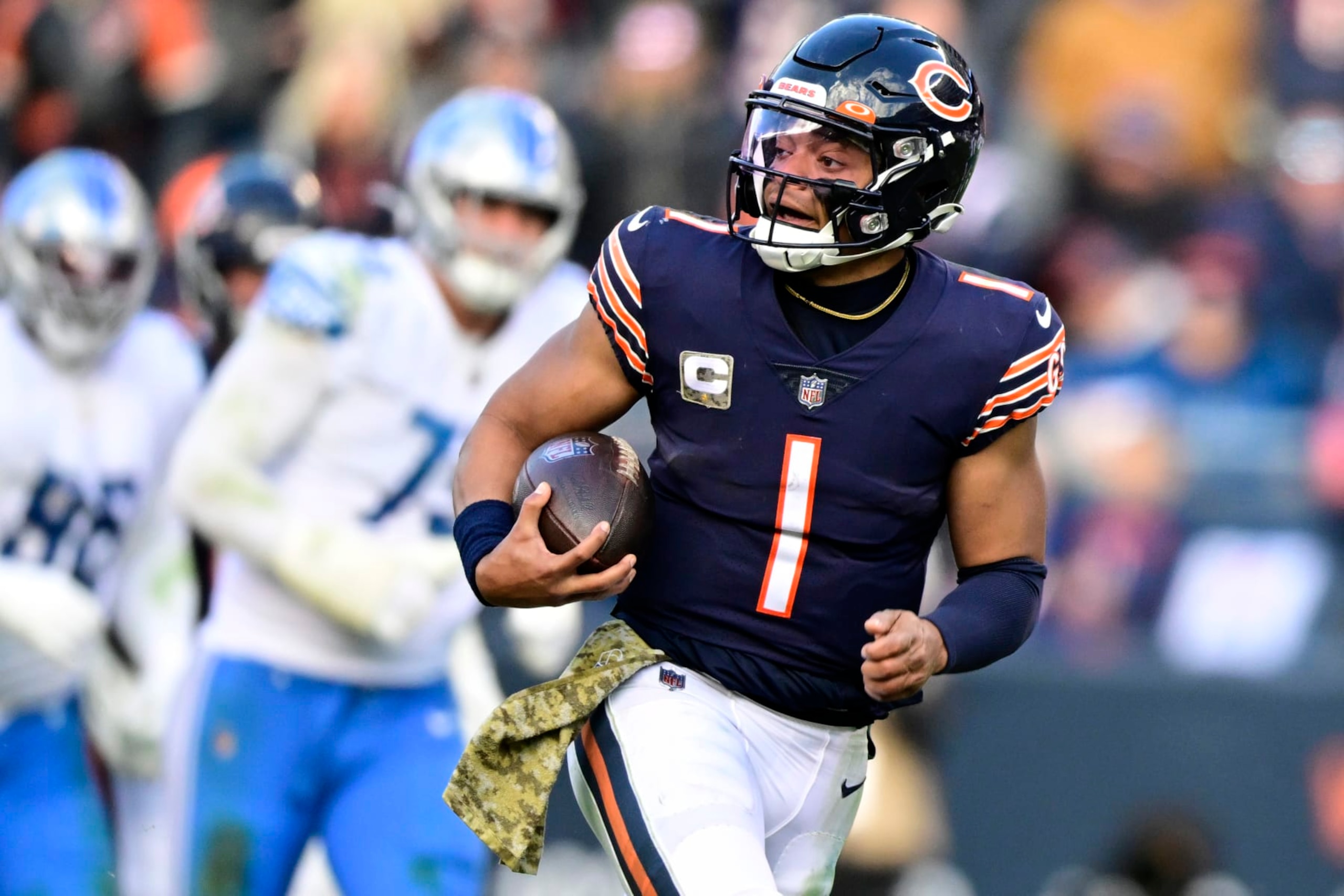 CHICAGO, ILLINOIS - NOVEMBER 13: Justin Fields #1 of the Chicago Bears scores a touchdown during the fourth quarter against the Detroit Lions at Soldier Field on November 13, 2022 in Chicago, Illinois. (Photo by Quinn Harris/Getty Images) CHICAGO, ILLINOIS - NOVEMBER 13: Justin Fields #1 of the Chicago Bears scores a touchdown during the fourth quarter against the Detroit Lions at Soldier Field on November 13, 2022 in Chicago, Illinois. (Photo by Quinn Harris/Getty Images)