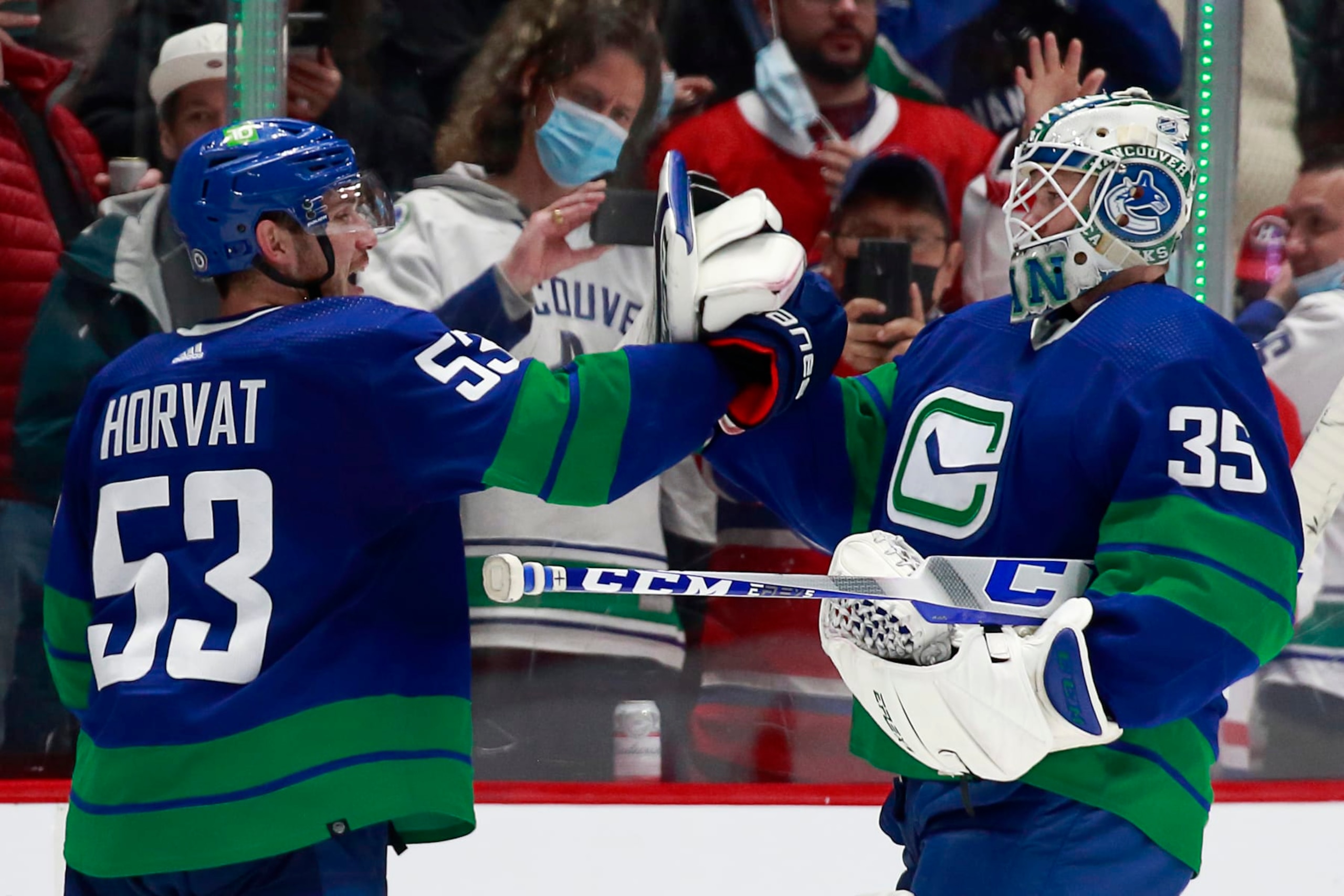 Vancouver Canucks center Bo Horvat (left) and goaltender Thatcher Demko Vancouver Canucks center Bo Horvat (left) and goaltender Thatcher Demko