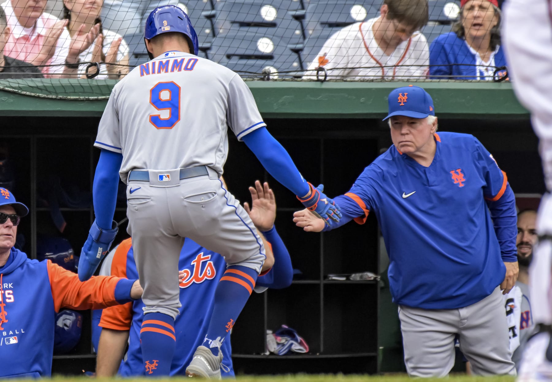 WASHINGTON, DC - May 12: New York Mets center fielder Brandon Nimmo (9) is congratulated by manager Buck Showalter (11) after scoring in the first inning during the New York Mets versus the Washington Nationals on May 12, 2022 at Nationals Park in Washington, D.C. (Photo by Mark Goldman/Icon Sportswire via Getty Images)