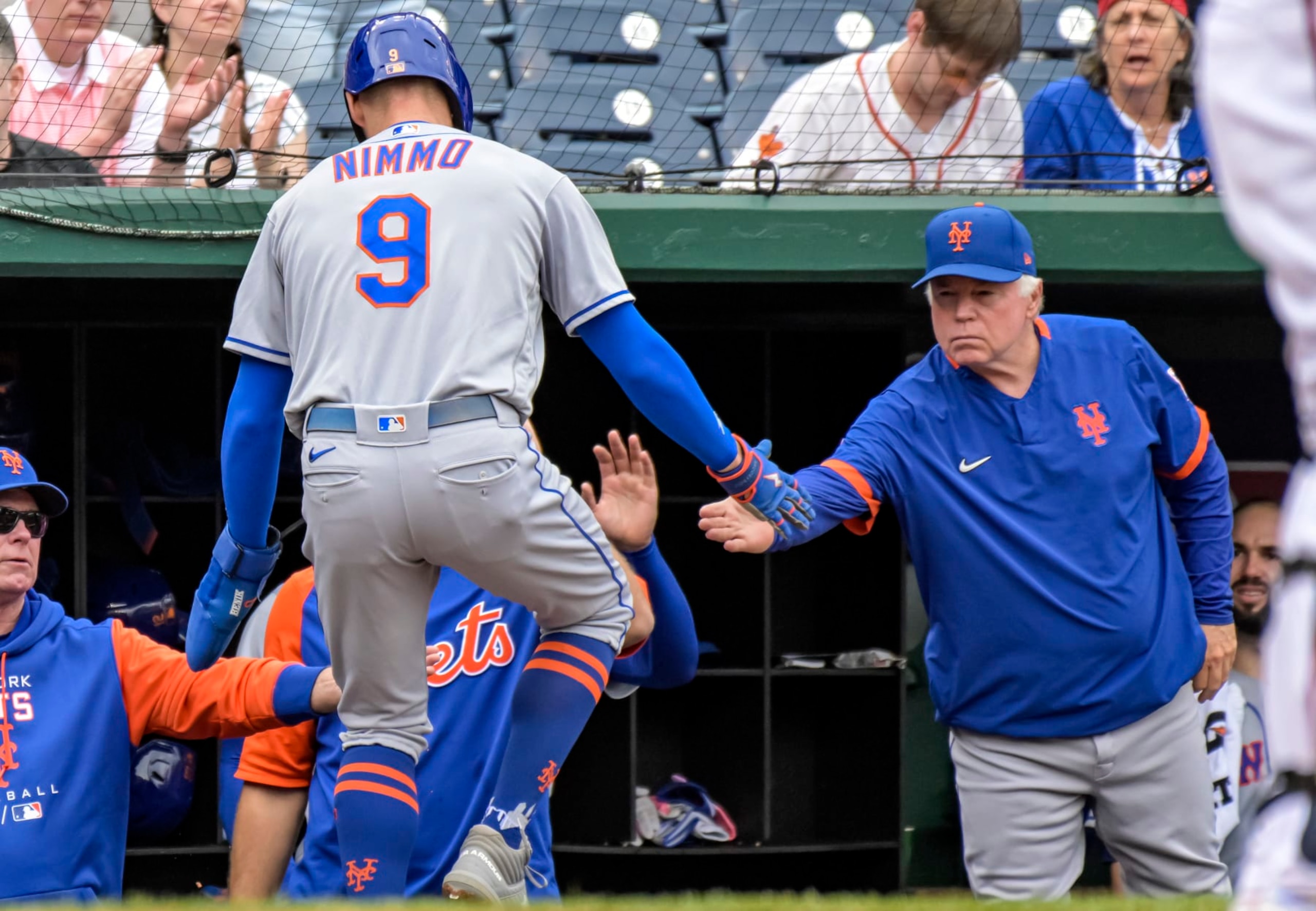 WASHINGTON, DC - May 12: New York Mets center fielder Brandon Nimmo (9) is congratulated by manager Buck Showalter (11) after scoring in the first inning during the New York Mets versus the Washington Nationals on May 12, 2022 at Nationals Park in Washington, D.C. (Photo by Mark Goldman/Icon Sportswire via Getty Images)
