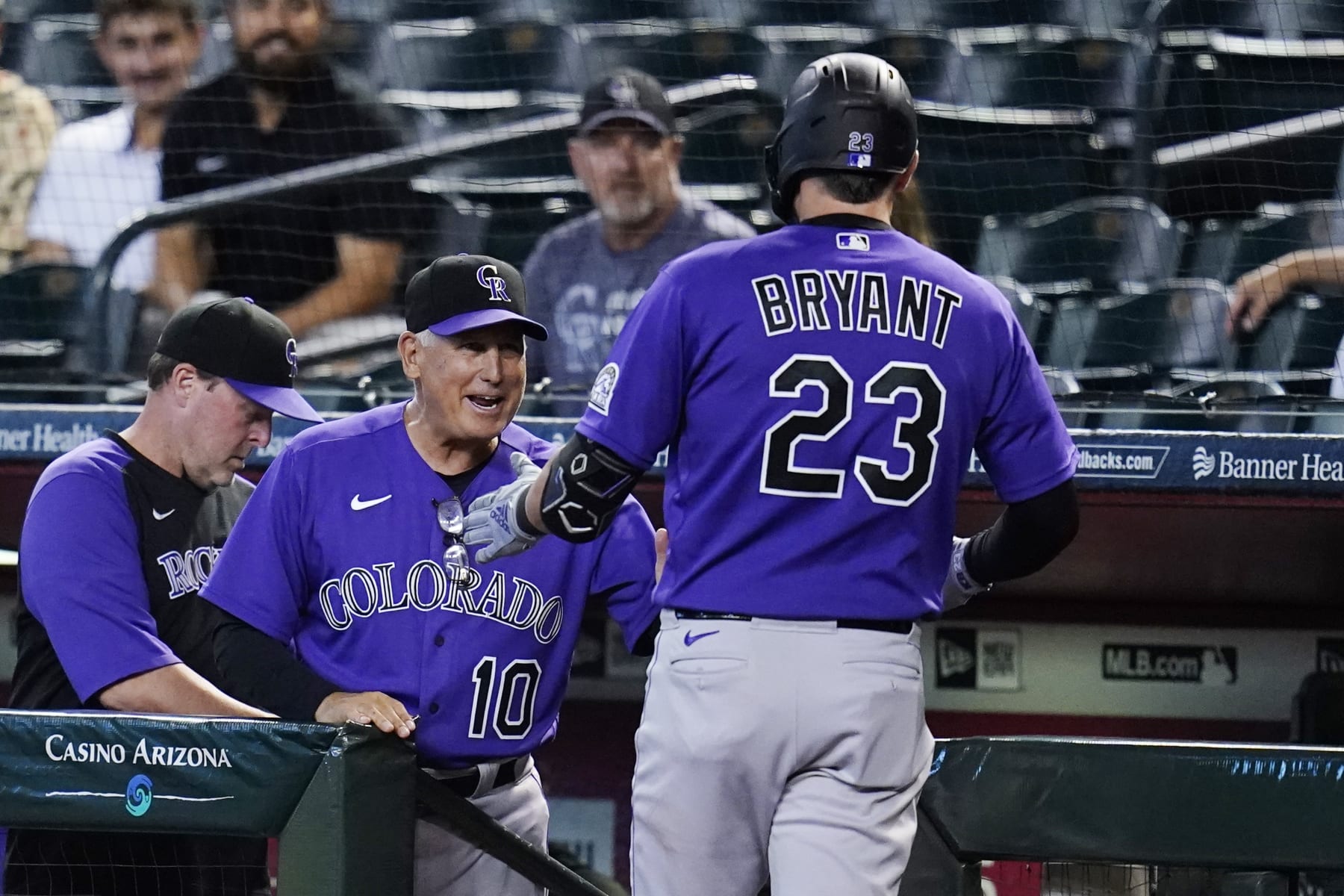 Colorado Rockies manager Bud Black (10) celebrates with Rockies' Kris Bryant (23) after Bryant's home run against the Arizona Diamondbacks during the first inning of a baseball game Friday, July 8, 2022, in Phoenix. (AP Photo/Ross D. Franklin)
