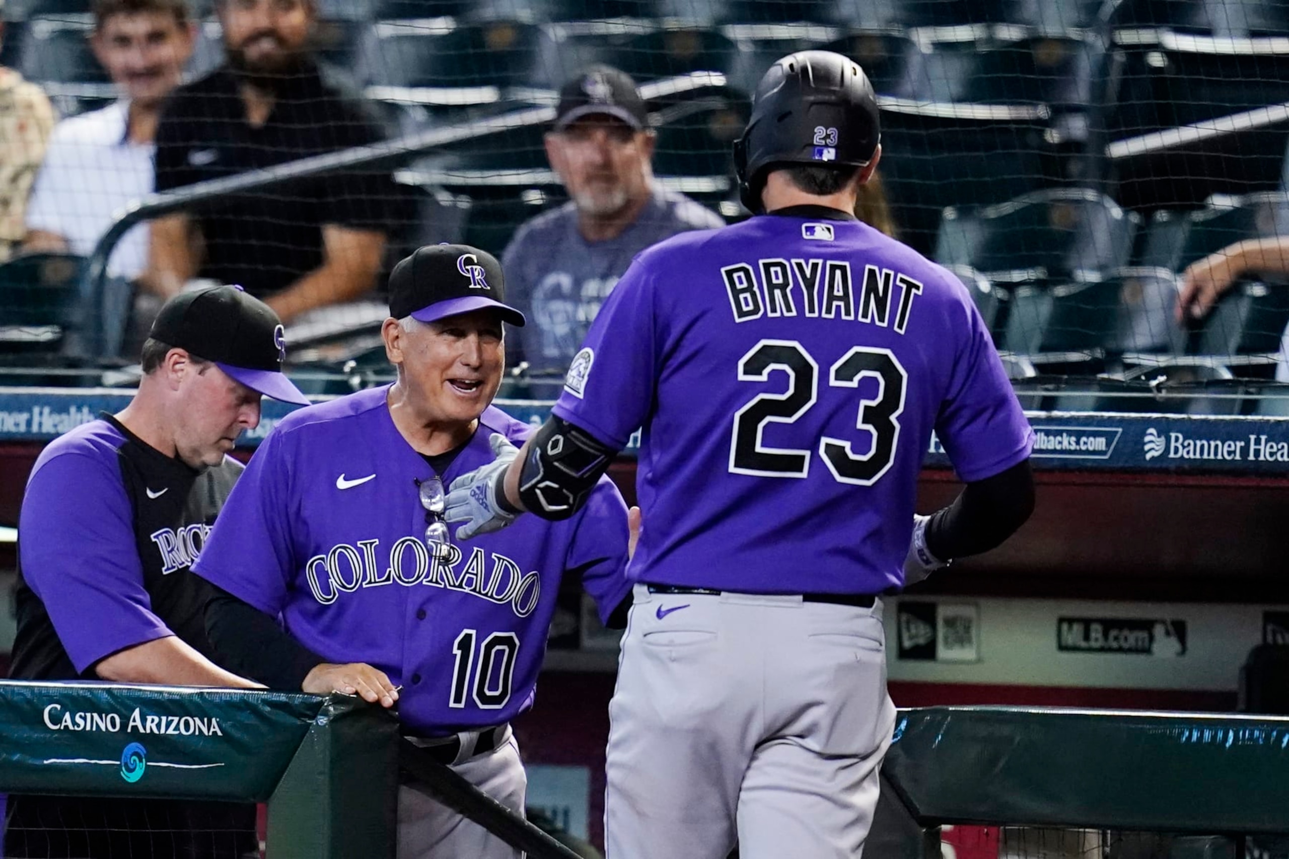 Colorado Rockies manager Bud Black (10) celebrates with Rockies' Kris Bryant (23) after Bryant's home run against the Arizona Diamondbacks during the first inning of a baseball game Friday, July 8, 2022, in Phoenix. (AP Photo/Ross D. Franklin)