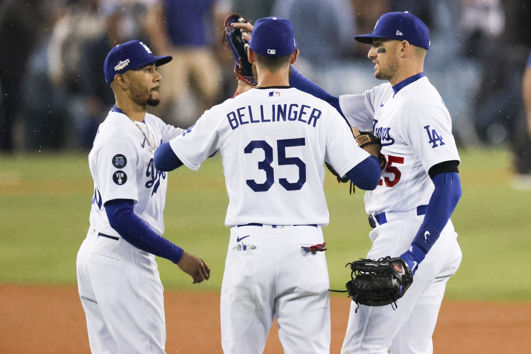 Los Angeles, CA - October 12: From left, Los Angeles Dodgers Mookie Betts celebrates with Cody Bellinger and Trayce Thompson after game one of the NLDS at Dodger Stadium against the San Diego Padres on Wednesday, Oct. 12, 2022 in Los Angeles, CA.(Gina Ferazzi / Los Angeles Times via Getty Images)