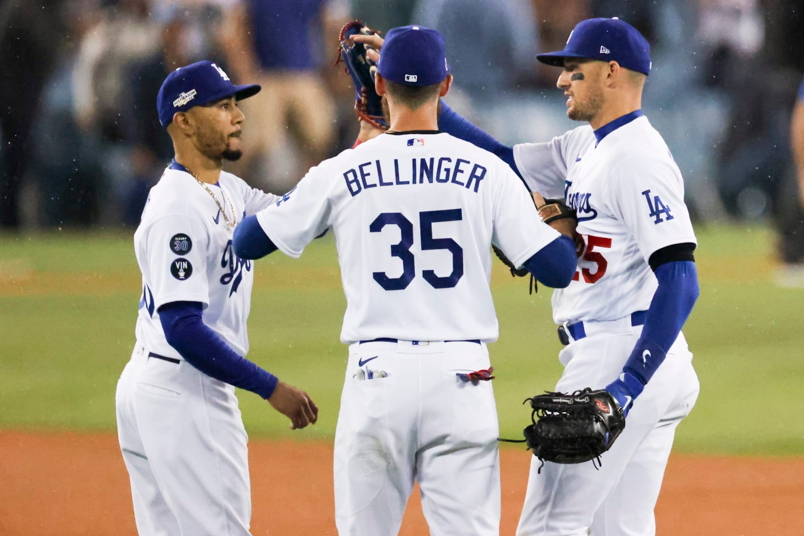 Los Angeles, CA - October 12: From left, Los Angeles Dodgers Mookie Betts celebrates with Cody Bellinger and Trayce Thompson after game one of the NLDS at Dodger Stadium against the San Diego Padres on Wednesday, Oct. 12, 2022 in Los Angeles, CA.(Gina Ferazzi / Los Angeles Times via Getty Images)