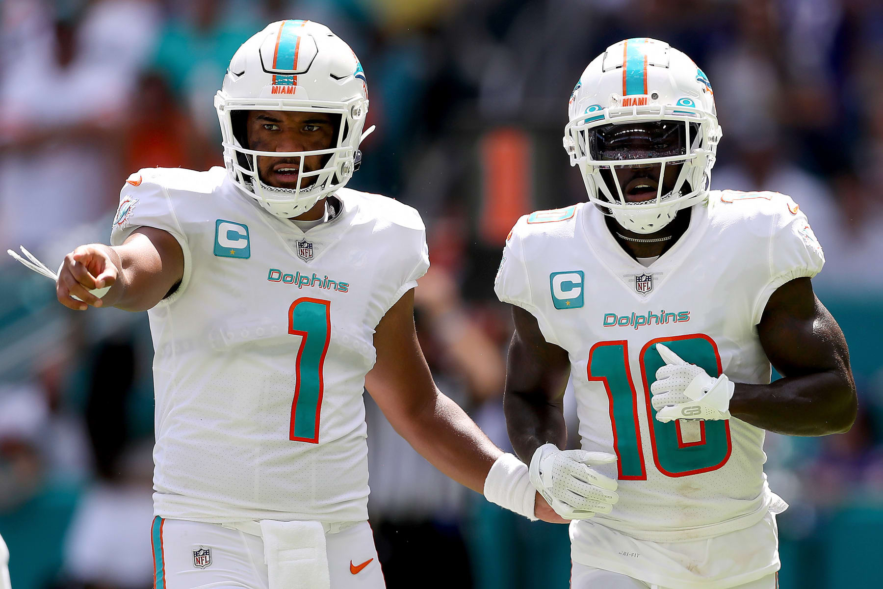 MIAMI GARDENS, FLORIDA - SEPTEMBER 25: Tua Tagovailoa #1 and Tyreek Hill #10 of the Miami Dolphins in action during the first half of the game against the Buffalo Bills at Hard Rock Stadium on September 25, 2022 in Miami Gardens, Florida. (Photo by Megan Briggs/Getty Images)