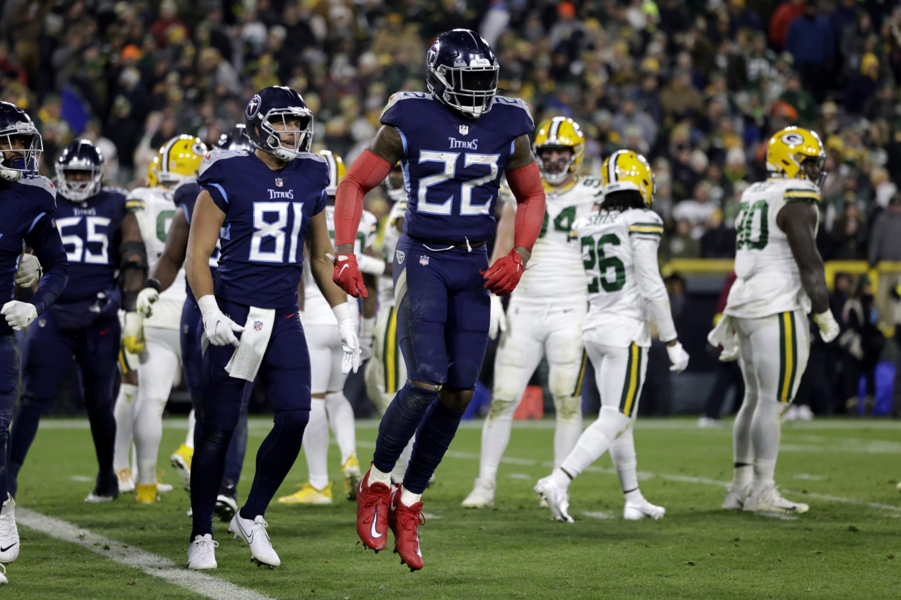 Tennessee Titans running back Derrick Henry (22) and Austin Hooper (81) celebrate after Henry ran for a touchdown during the first half of an NFL football game against the Green Bay Packers, Thursday, Nov. 17, 2022, in Green Bay, Wis. (AP Photo/Matt Ludtke)