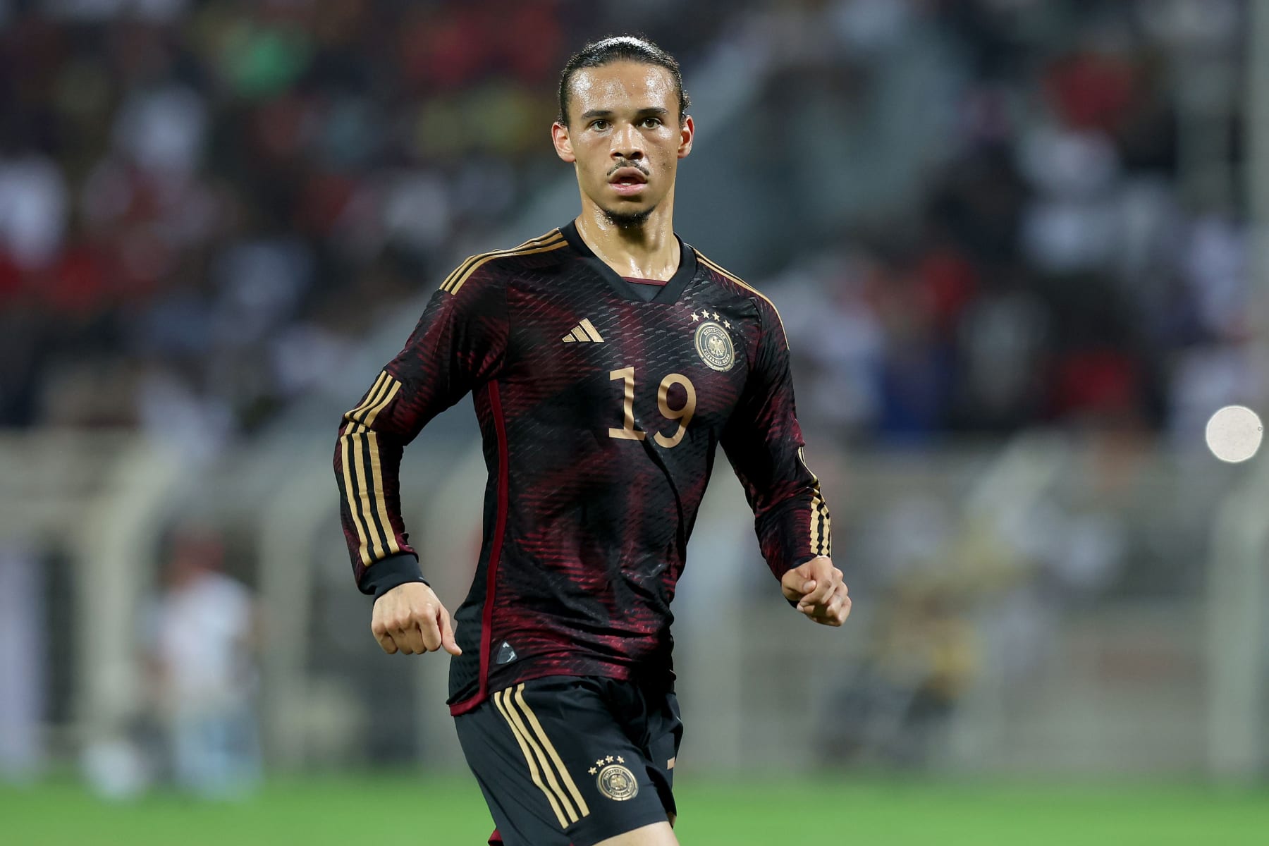 MUSCAT, OMAN - NOVEMBER 16: Leroy Sane of Germany looks on during the international friendly match between Germany and Oman at Sultan Qaboos Sports Complex on November 16, 2022 in Muscat, Oman. (Photo by Alexander Hassenstein/Getty Images)