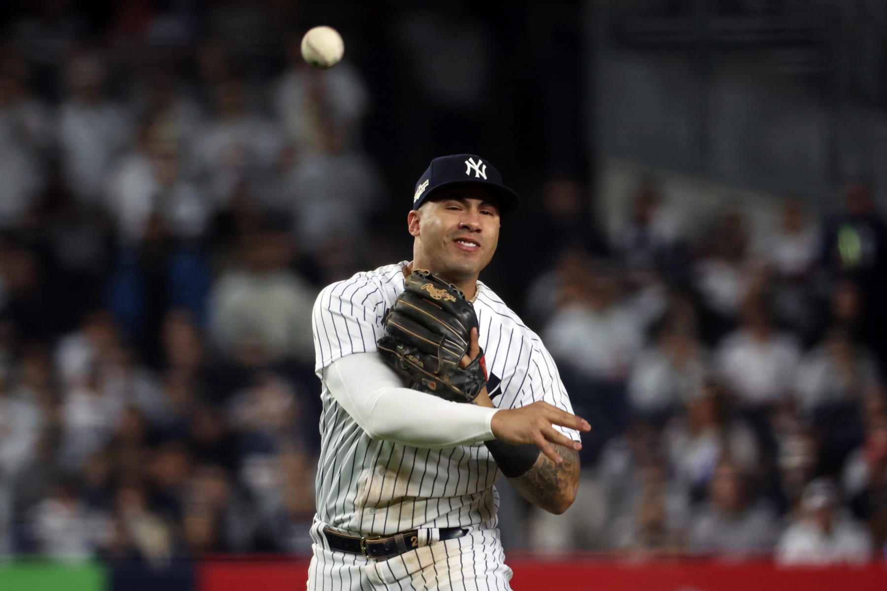 NEW YORK, NY - OCTOBER 22:  Gleyber Torres #25 of the New York Yankees throws to first base for the out during Game 3 of the ALCS between the Houston Astros and the New York Yankees at Yankee Stadium on Saturday, October 22, 2022 in New York, New York. (Photo by Mary DeCicco/MLB Photos via Getty Images)