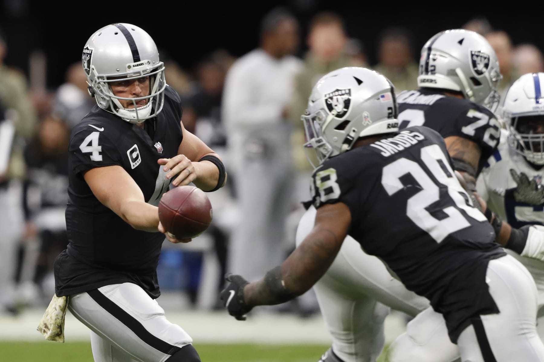 LAS VEGAS, NEVADA - NOVEMBER 13: Derek Carr #4 of the Las Vegas Raiders hands the ball off to Josh Jacobs #28 during the second quarter of the game against the Indianapolis Colts at Allegiant Stadium on November 13, 2022 in Las Vegas, Nevada. (Photo by Steve Marcus/Getty Images)