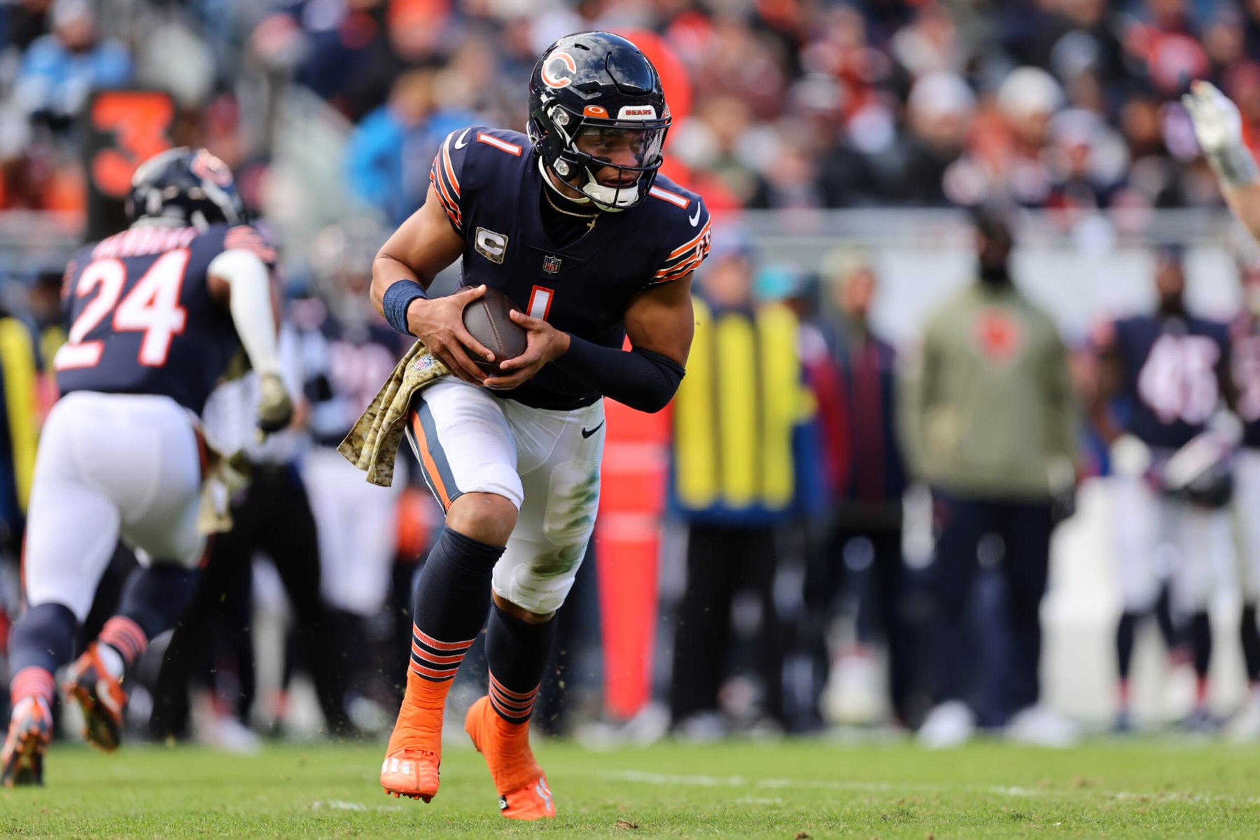 CHICAGO, ILLINOIS - NOVEMBER 13: Justin Fields #1 of the Chicago Bears runs the ball during the second quarter against the Detroit Lions at Soldier Field on November 13, 2022 in Chicago, Illinois. (Photo by Michael Reaves/Getty Images) CHICAGO, ILLINOIS - NOVEMBER 13: Justin Fields #1 of the Chicago Bears runs the ball during the second quarter against the Detroit Lions at Soldier Field on November 13, 2022 in Chicago, Illinois. (Photo by Michael Reaves/Getty Images)