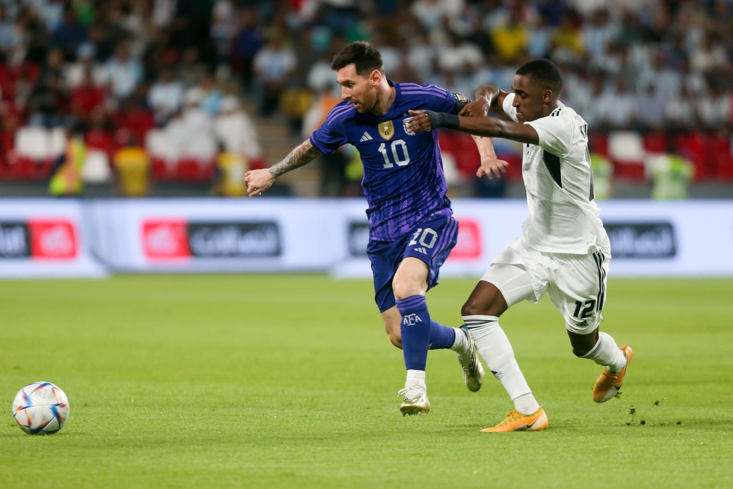 ABU DHABI, UNITED ARAB EMIRATES - NOVEMBER 16: Lionel Messi of Argentina in action against Khalifa Al Hammadi of UAE during a friendly match between UAE and Argentina ahead of FIFA 2022 World Cup at Mohammed bin Zayed Stadium in Abu Dhabi, United Arab Emirates on November 16, 2022. (Photo by Waleed Zein/Anadolu Agency via Getty Images) ABU DHABI, UNITED ARAB EMIRATES - NOVEMBER 16: Lionel Messi of Argentina in action against Khalifa Al Hammadi of UAE during a friendly match between UAE and Argentina ahead of FIFA 2022 World Cup at Mohammed bin Zayed Stadium in Abu Dhabi, United Arab Emirates on November 16, 2022. (Photo by Waleed Zein/Anadolu Agency via Getty Images)