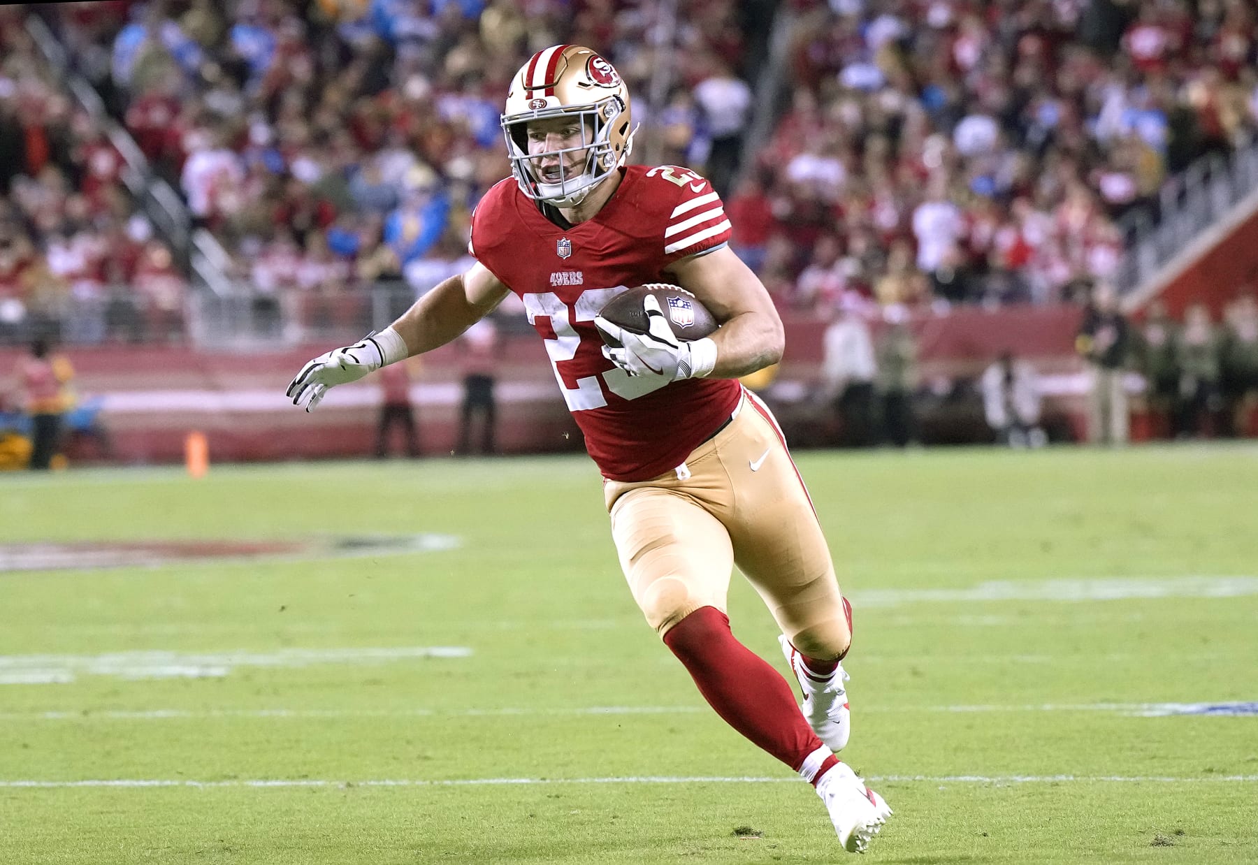 SANTA CLARA, CALIFORNIA - NOVEMBER 13: Christian McCaffrey #23 of the San Francisco 49ers rushes with the ball during the second quarter against the Los Angeles Chargers at Levi's Stadium on November 13, 2022 in Santa Clara, California. (Photo by Thearon W. Henderson/Getty Images)