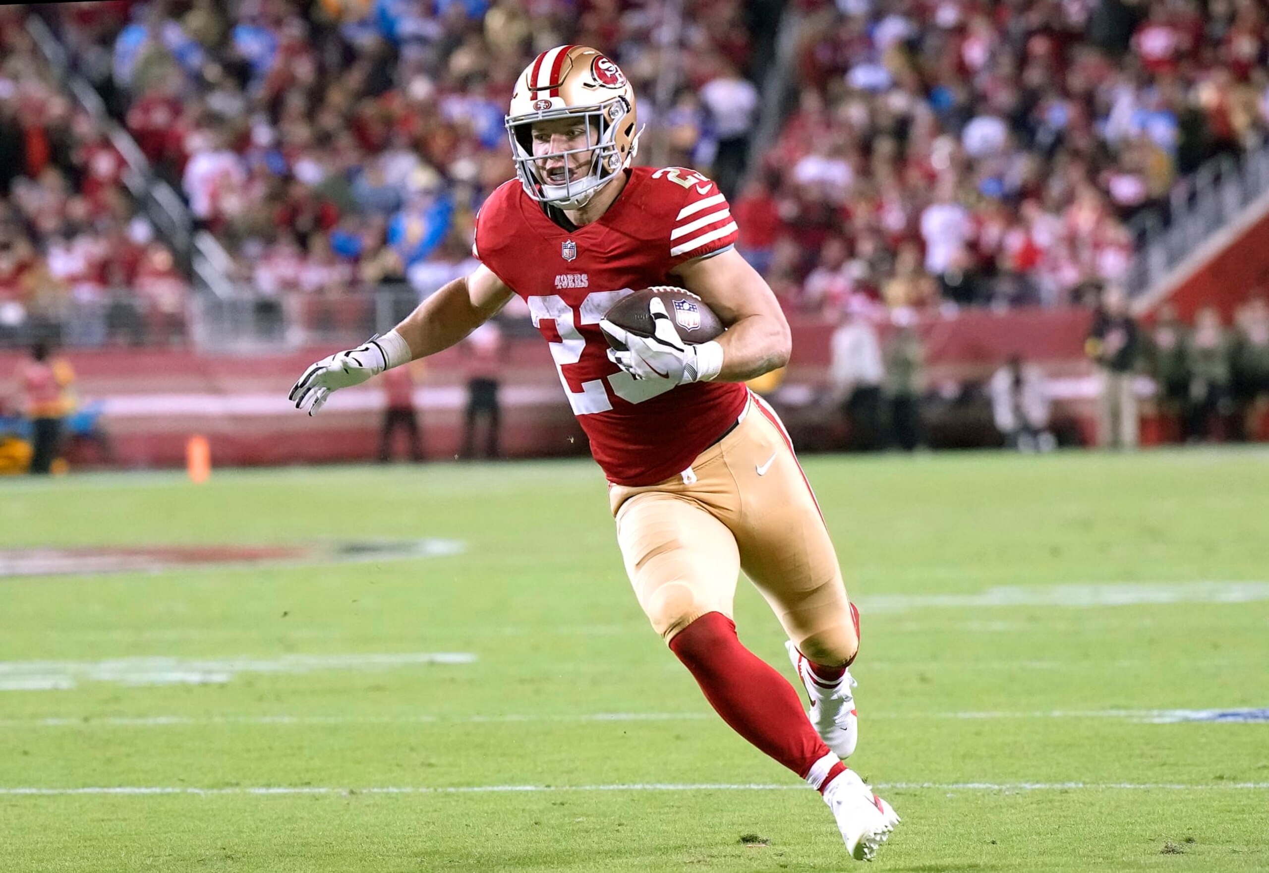 SANTA CLARA, CALIFORNIA - NOVEMBER 13: Christian McCaffrey #23 of the San Francisco 49ers rushes with the ball during the second quarter against the Los Angeles Chargers at Levi's Stadium on November 13, 2022 in Santa Clara, California. (Photo by Thearon W. Henderson/Getty Images) SANTA CLARA, CALIFORNIA - NOVEMBER 13: Christian McCaffrey #23 of the San Francisco 49ers rushes with the ball during the second quarter against the Los Angeles Chargers at Levi's Stadium on November 13, 2022 in Santa Clara, California. (Photo by Thearon W. Henderson/Getty Images)