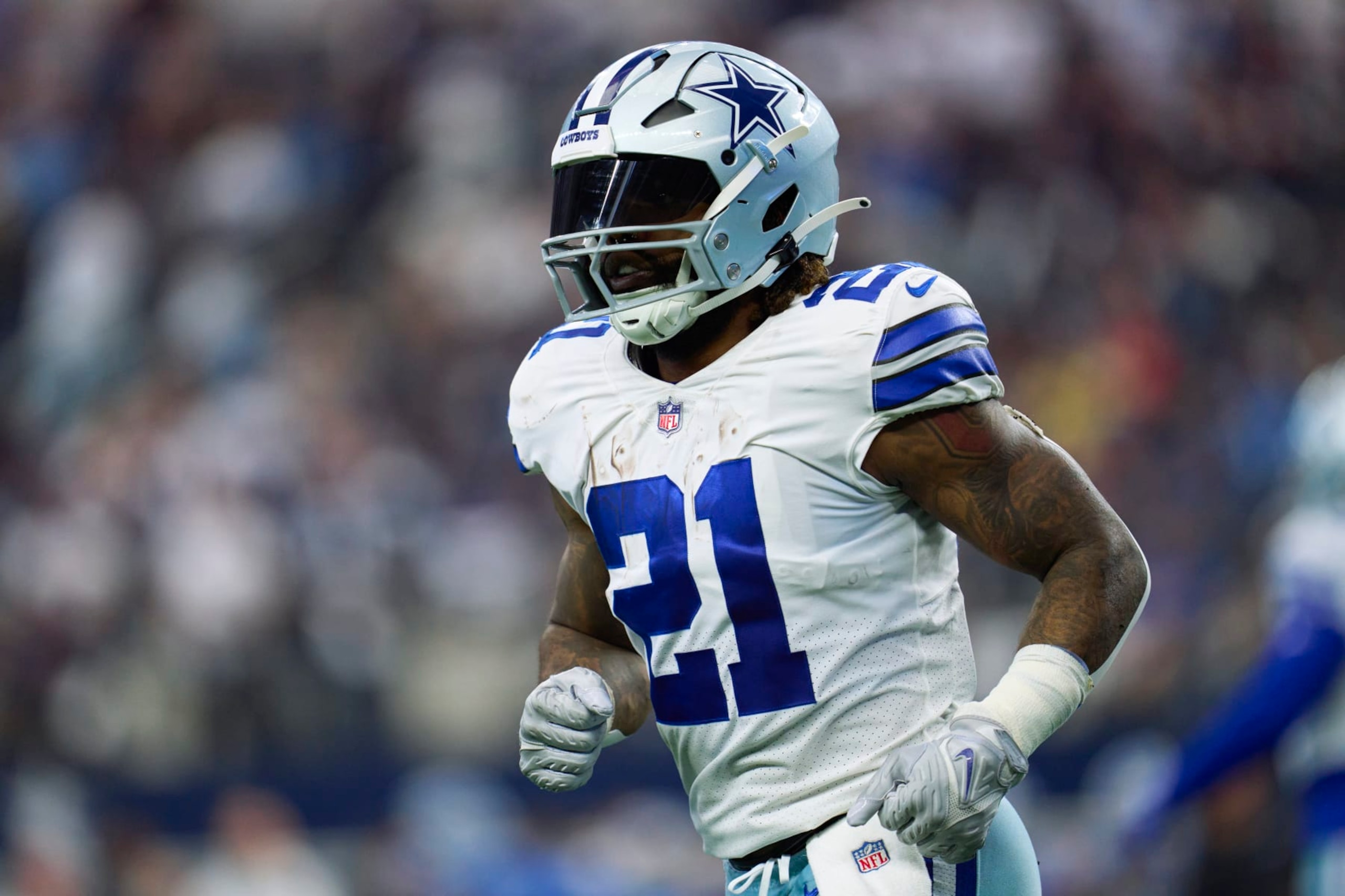 ARLINGTON, TX - OCTOBER 23: Ezekiel Elliott #21 of the Dallas Cowboys runs off the field against the Detroit Lions during the second half of the game at AT&T Stadium on October 23, 2022 in Arlington, Texas. (Photo by Cooper Neill/Getty Images) ARLINGTON, TX - OCTOBER 23: Ezekiel Elliott #21 of the Dallas Cowboys runs off the field against the Detroit Lions during the second half of the game at AT&T Stadium on October 23, 2022 in Arlington, Texas. (Photo by Cooper Neill/Getty Images)