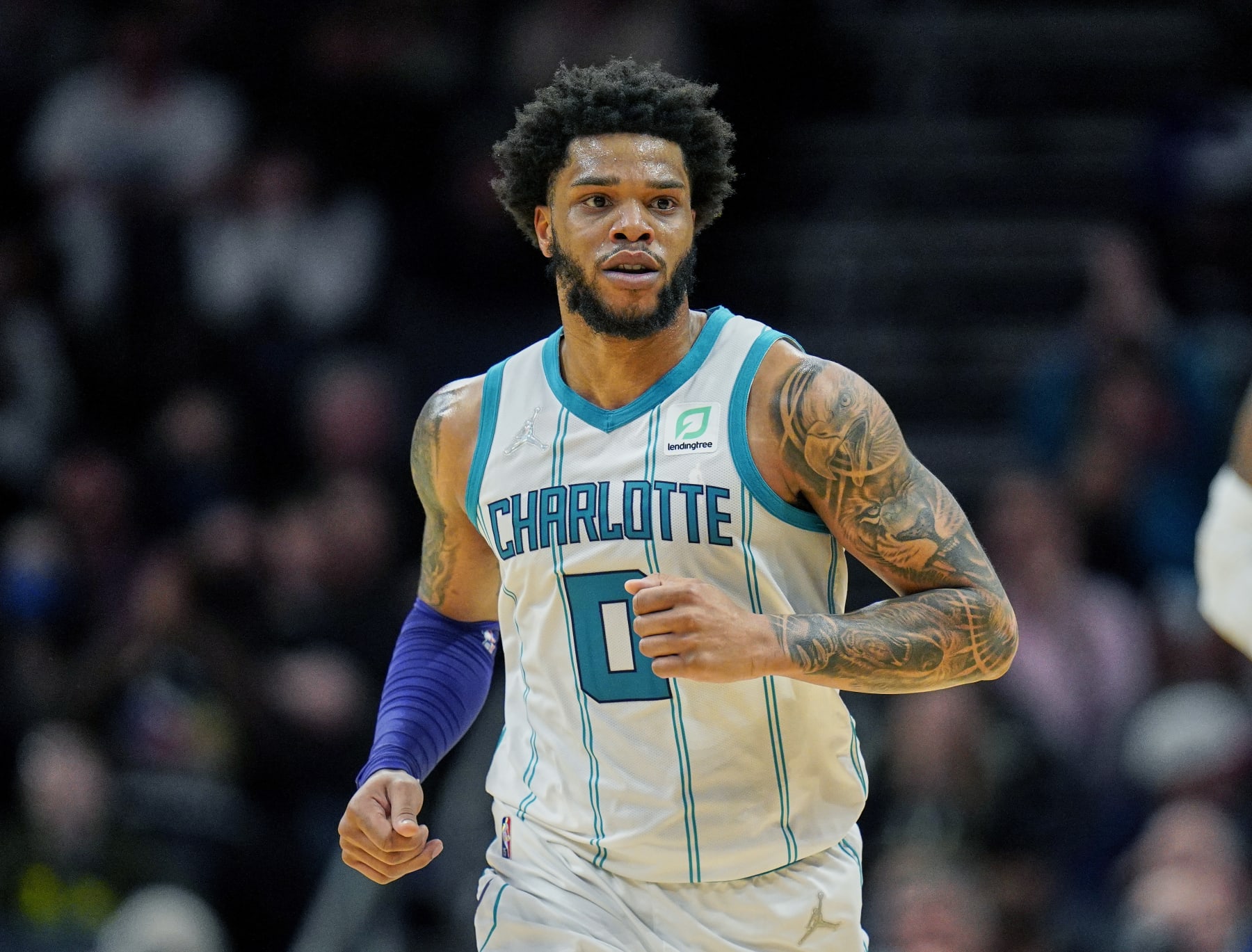 FILE - Charlotte Hornets forward Miles Bridges (0) moves up court during an NBA basketball game against the Denver Nuggets on Monday, March 28, 2022, in Charlotte, N.C. Hornets forward Miles Bridges was arrested Wednesday, June 29, 2022, in Los Angeles after a warrant was issued, according to the Los Angeles Police Department. The details of the arrest and the charges were not immediately available. (AP Photo/Rusty Jones, File)